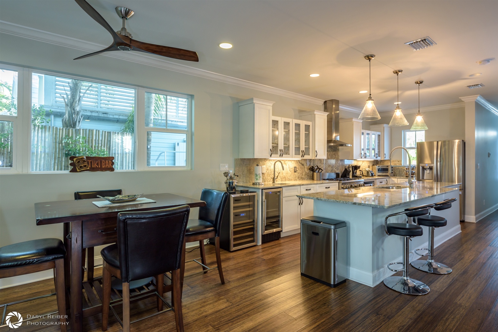 Dining area and full kitchen with breakfast bar