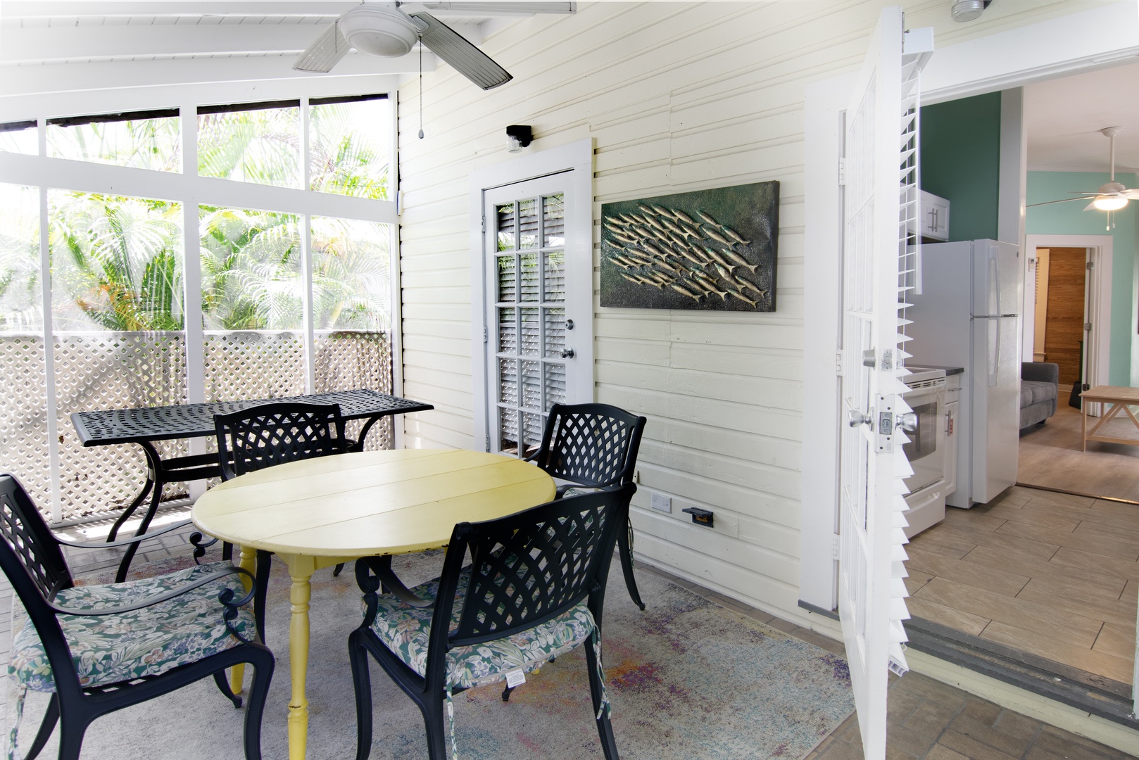 Private screened in covered patio with seating