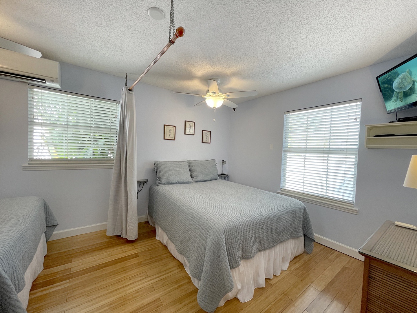 Bedroom upstairs with 2 Queen beds separated by curtain