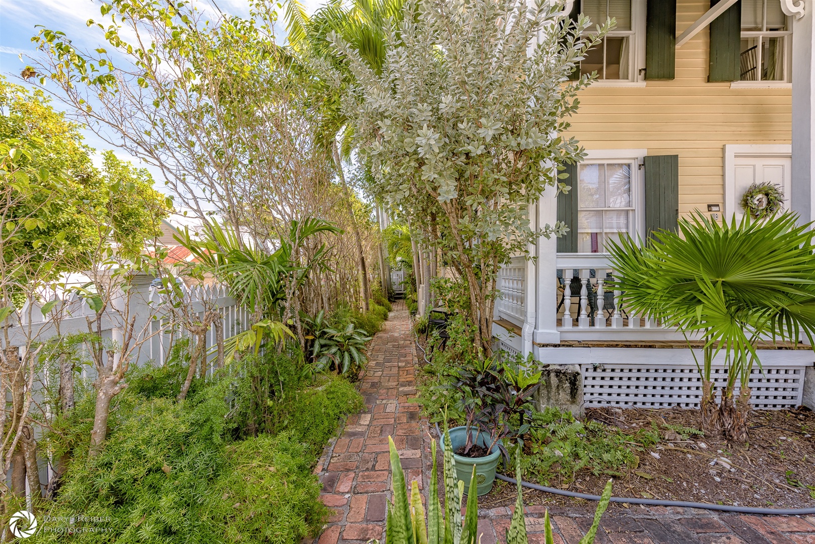 Pathway on side of the house leads to Mango Hideaway
