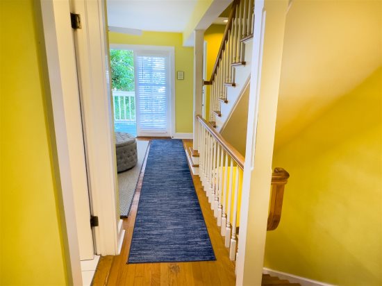 Stairs and Hall leading the 2nd Floor Living Room with Walk out Balcony