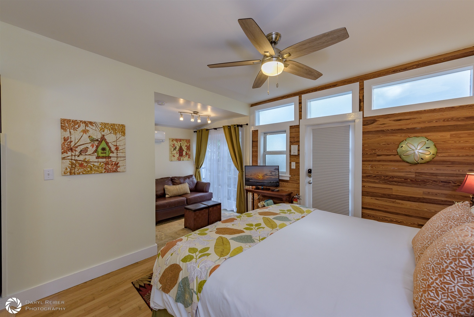 Bedroom area with view into sofa sitting area