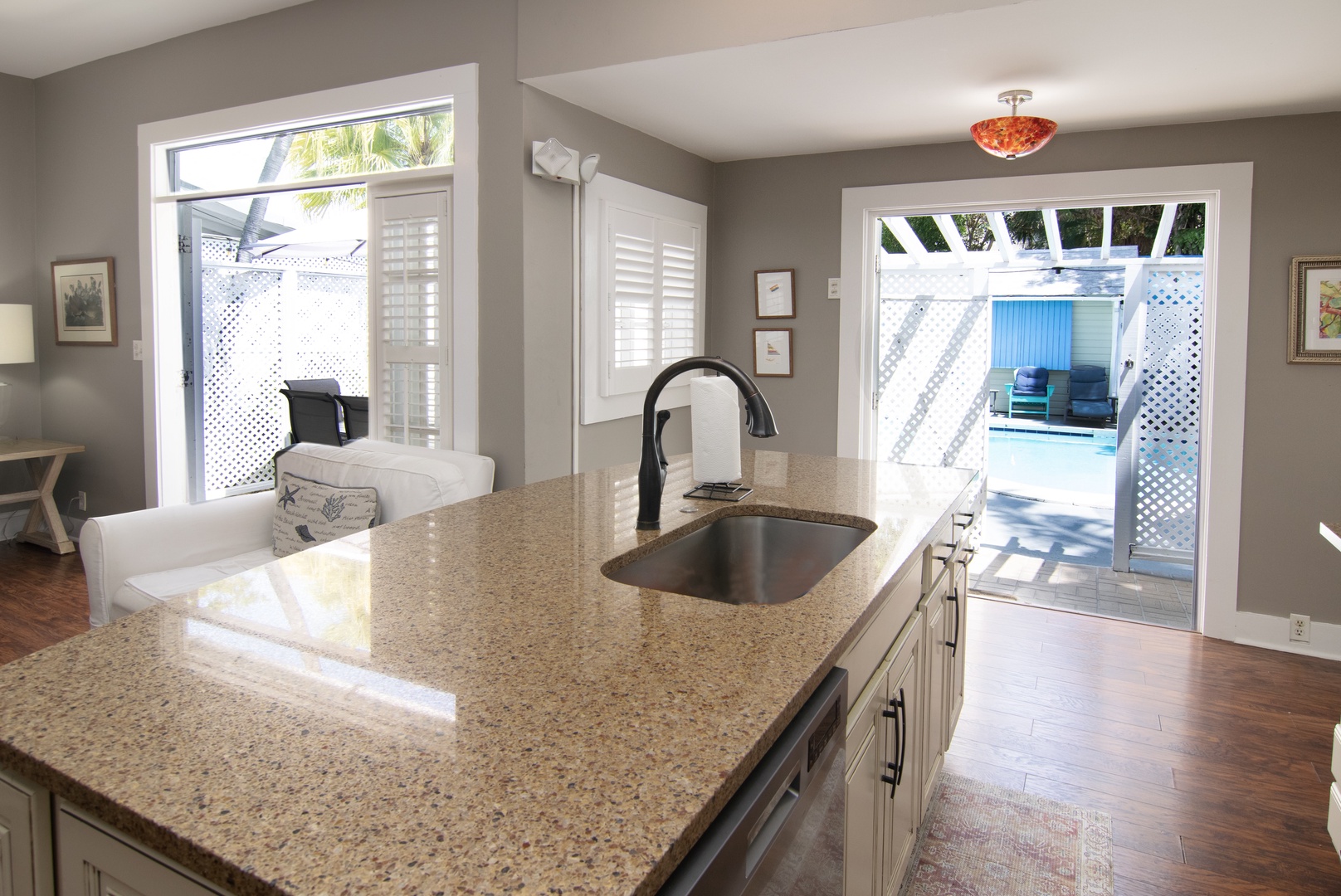 Kitchen with french doors that open up to common pool area