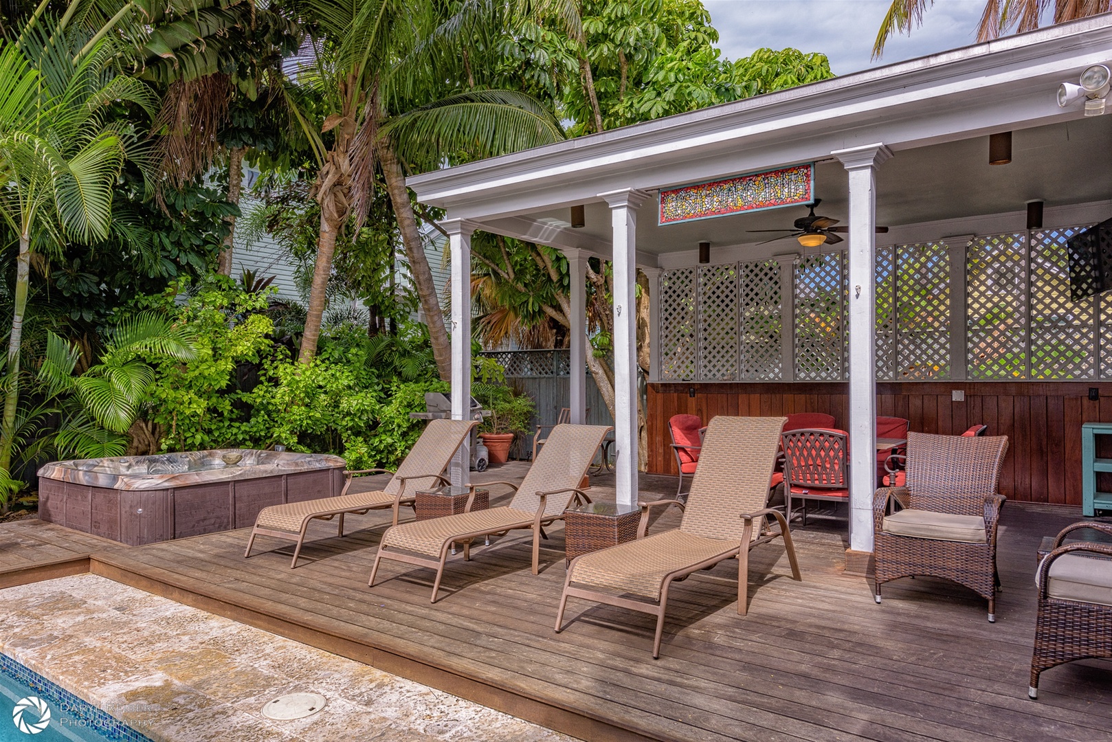 Hot tub with Lounge chairs and covered seating area