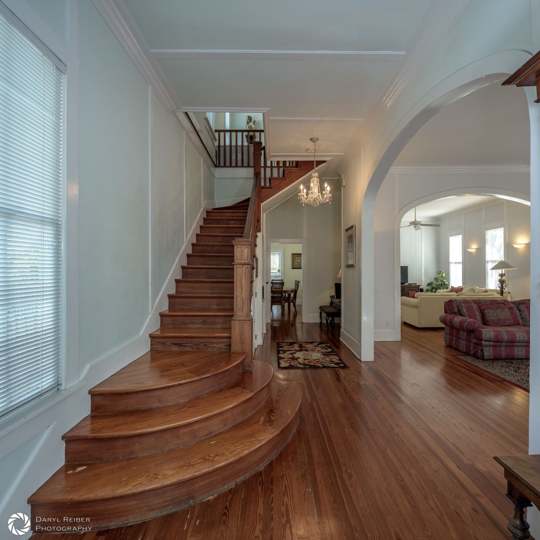 Main entry and stairs with view into living room