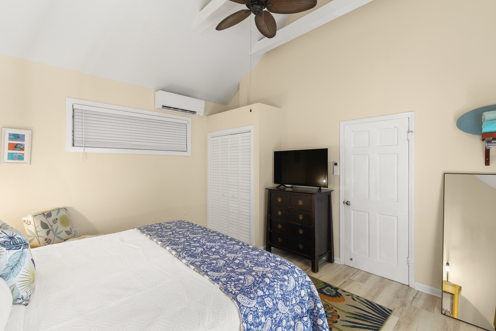 Sink into crisp linens and gentle ocean breezes in your restful coastal retreat, complete with tropical ceiling fan and modern comforts.