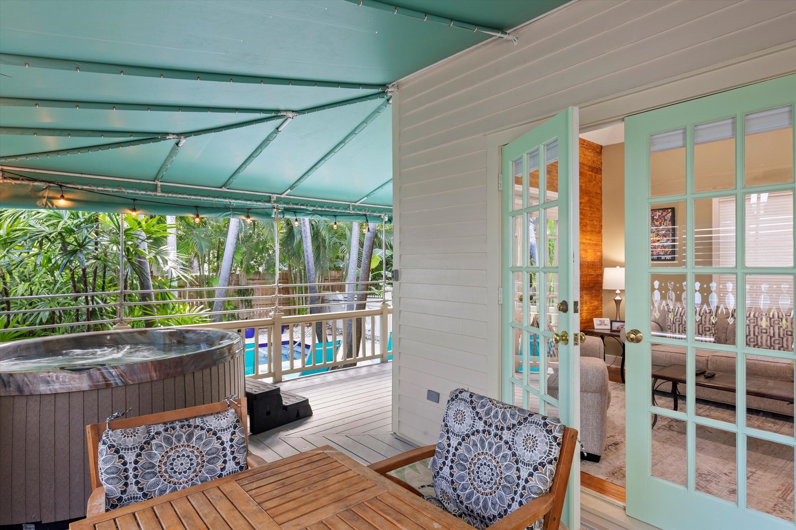 Private hot tub on wrap around porch and outdoor seating / 2nd french door entry