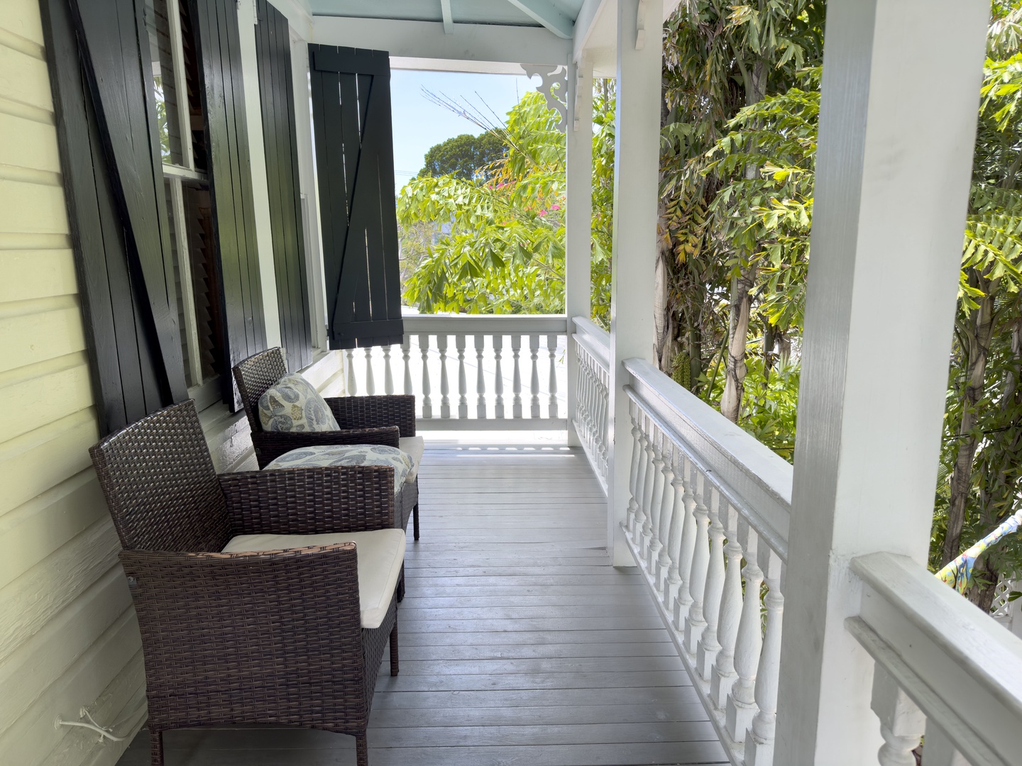 Covered front porch balcony with seating