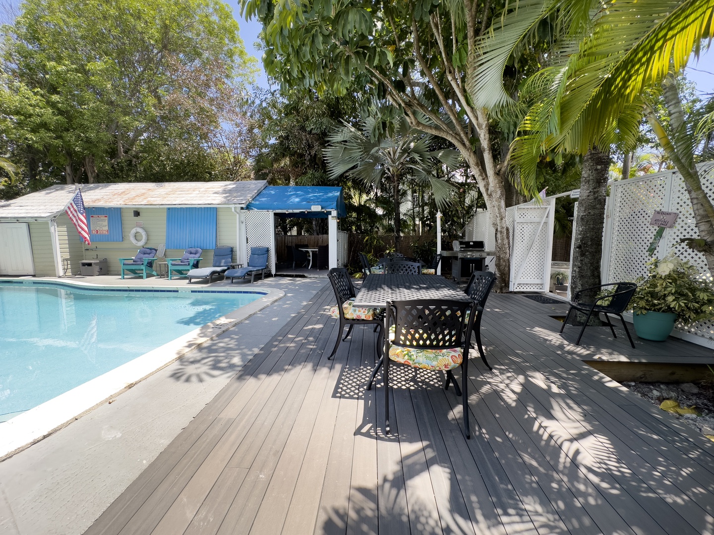 Shared deck with seating area next to pool