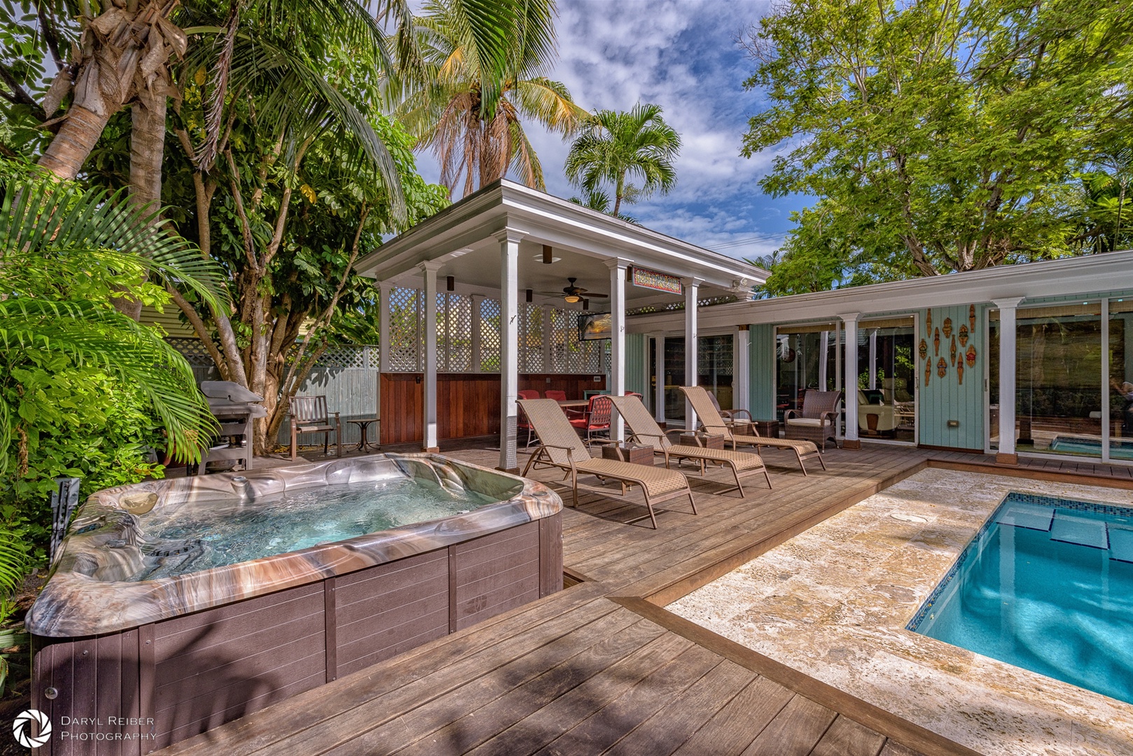 Hot tub with Lounge chairs and covered seating area