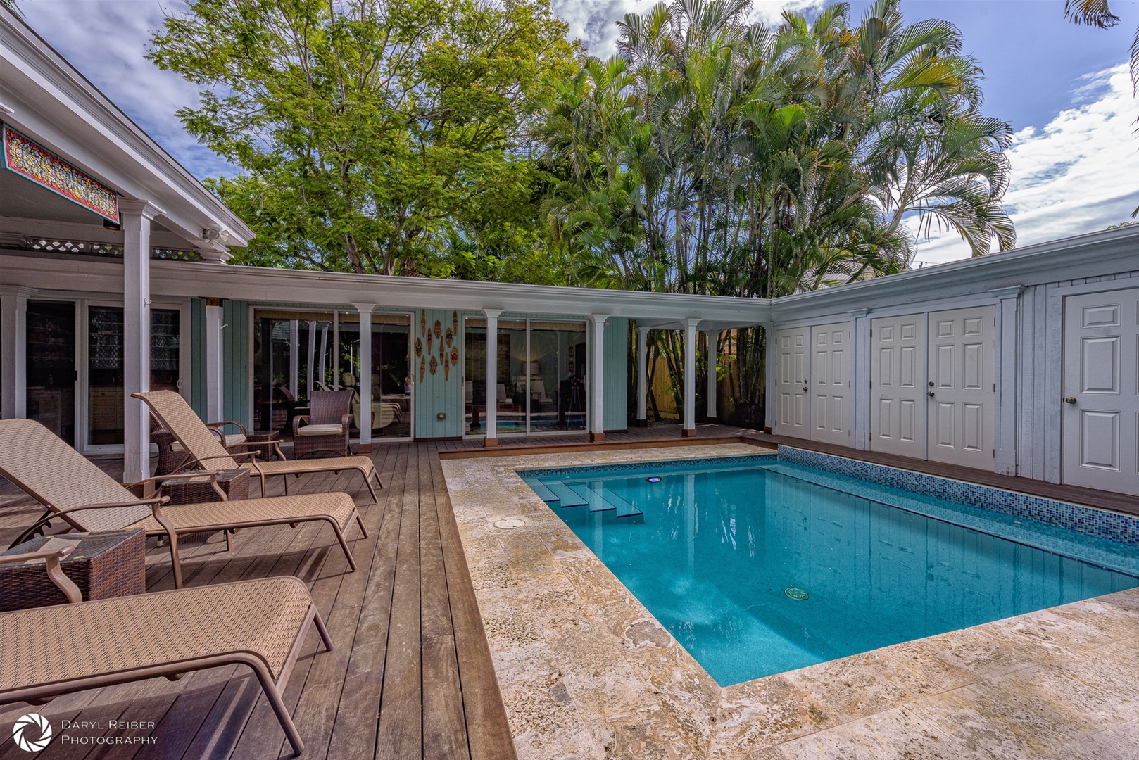 Private Pool and Hot tub with lounge chairs and covered seating area