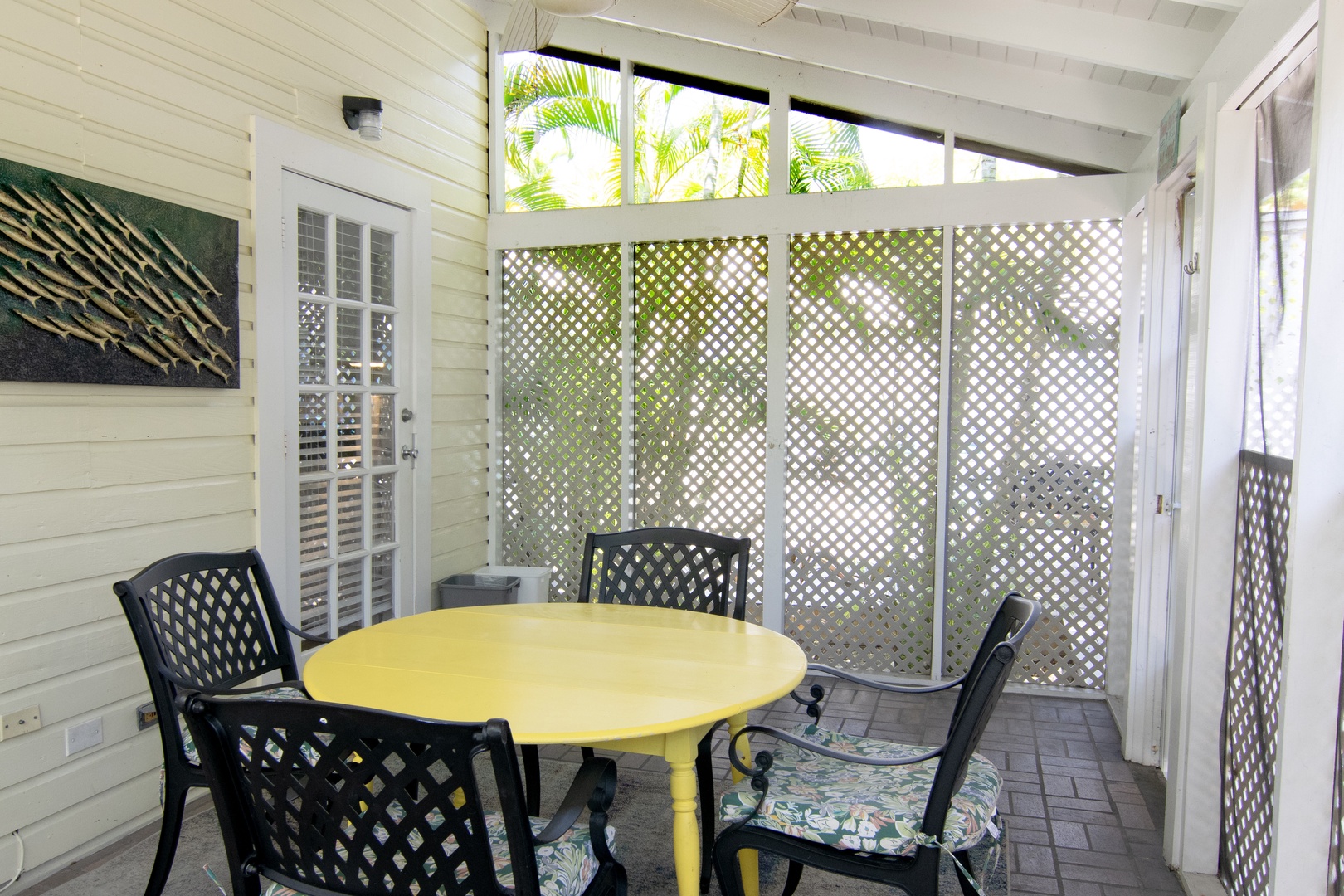 Private screened in covered patio with seating