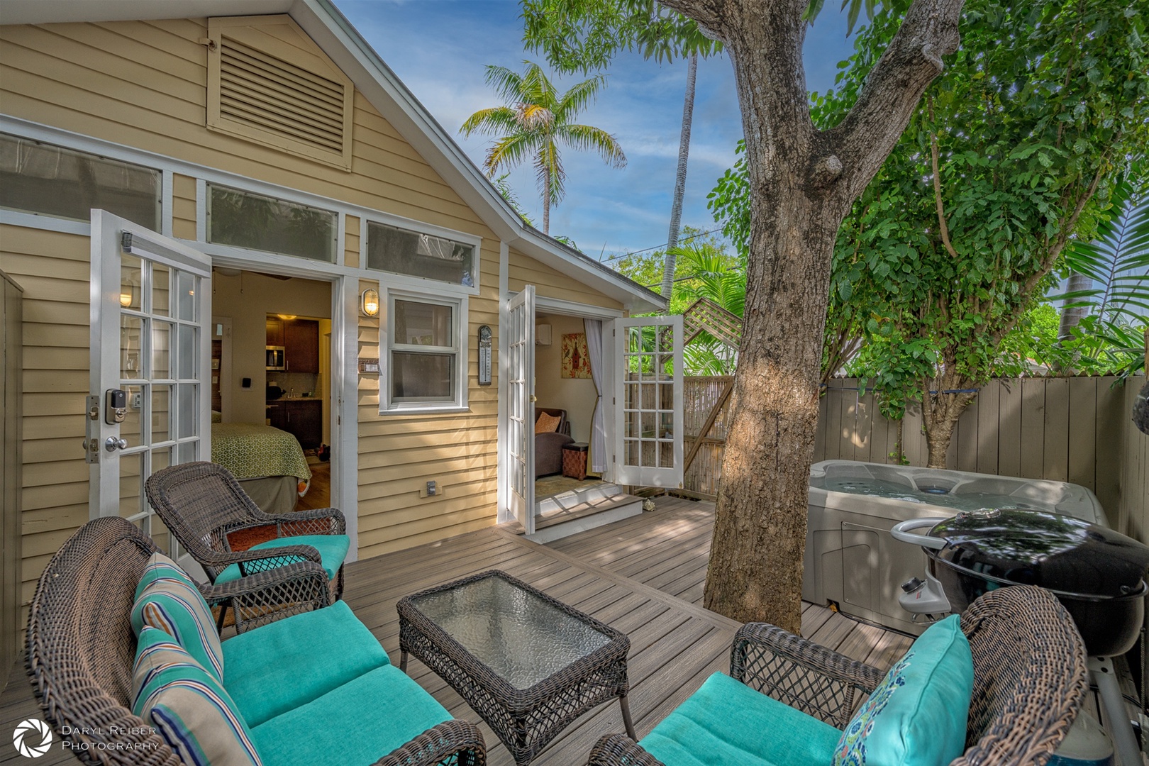 Private deck with hot tub, grill and sitting area