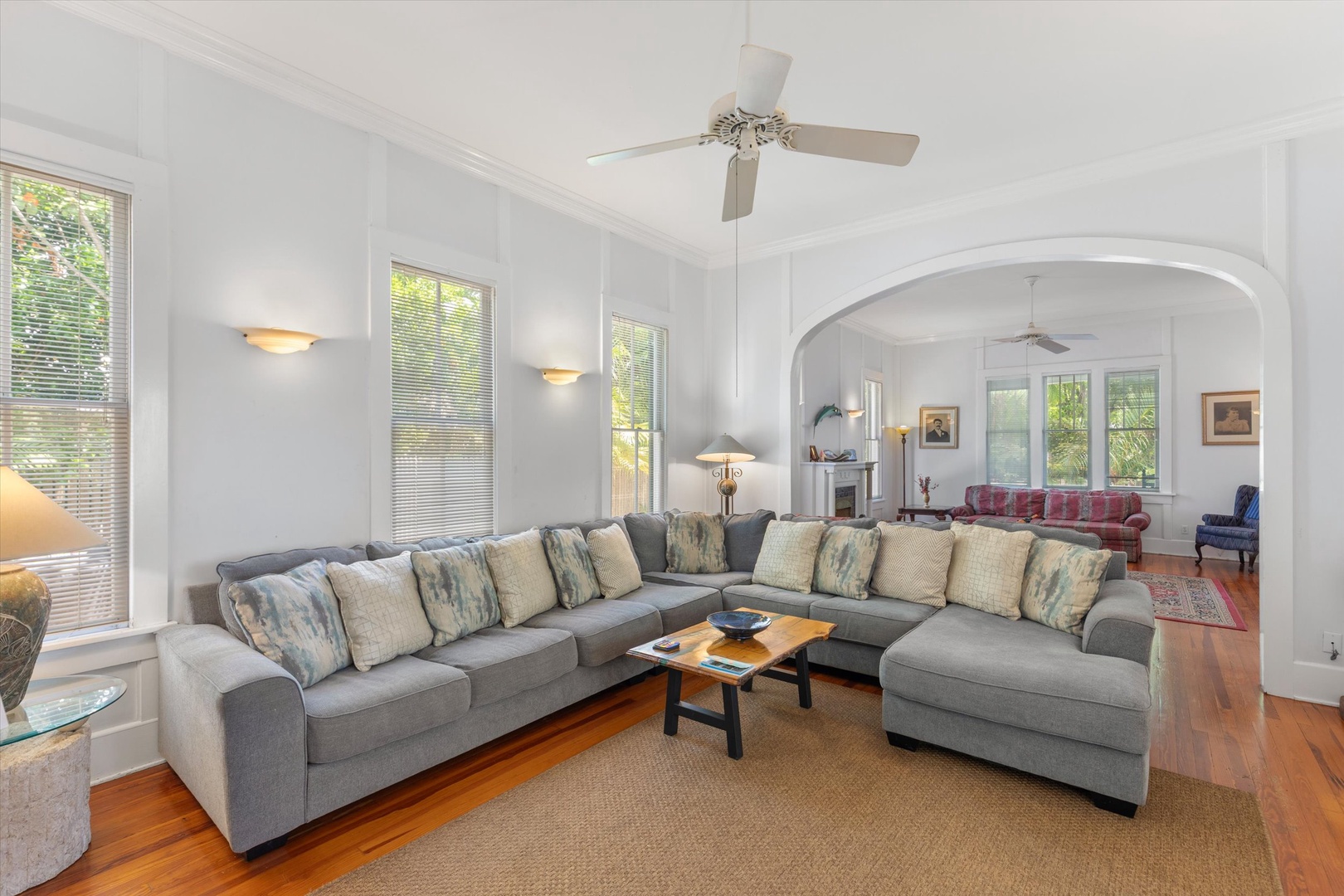 Sink into plush seating in your bright, airy living space. With soaring ceilings, elegant archways, and natural light streaming through tall windows, you'll find the perfect setting to unwind after exploring.