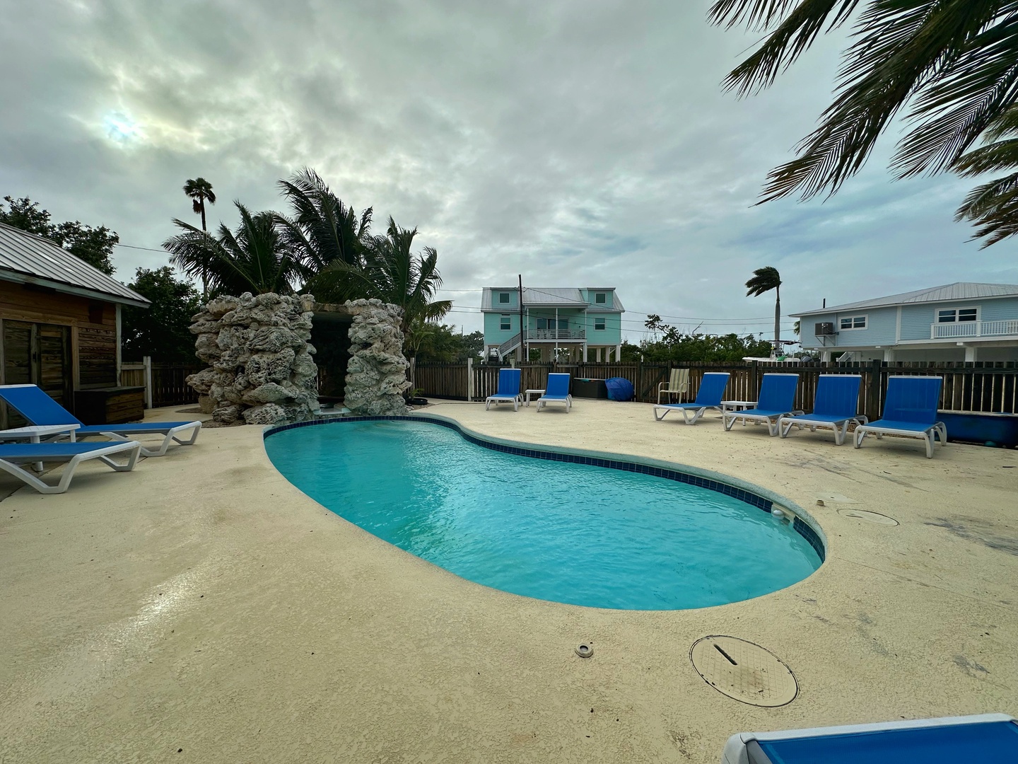 Slip into crystal-clear turquoise waters and unwind on your choice of poolside loungers, surrounded by swaying palms and coastal charm just steps from your door.