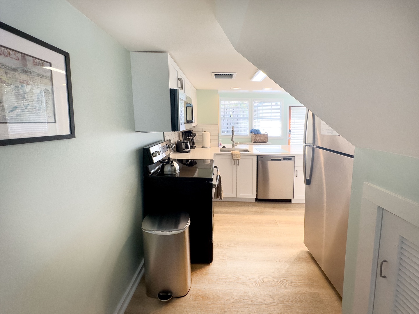 Kitchen with walkway into living room