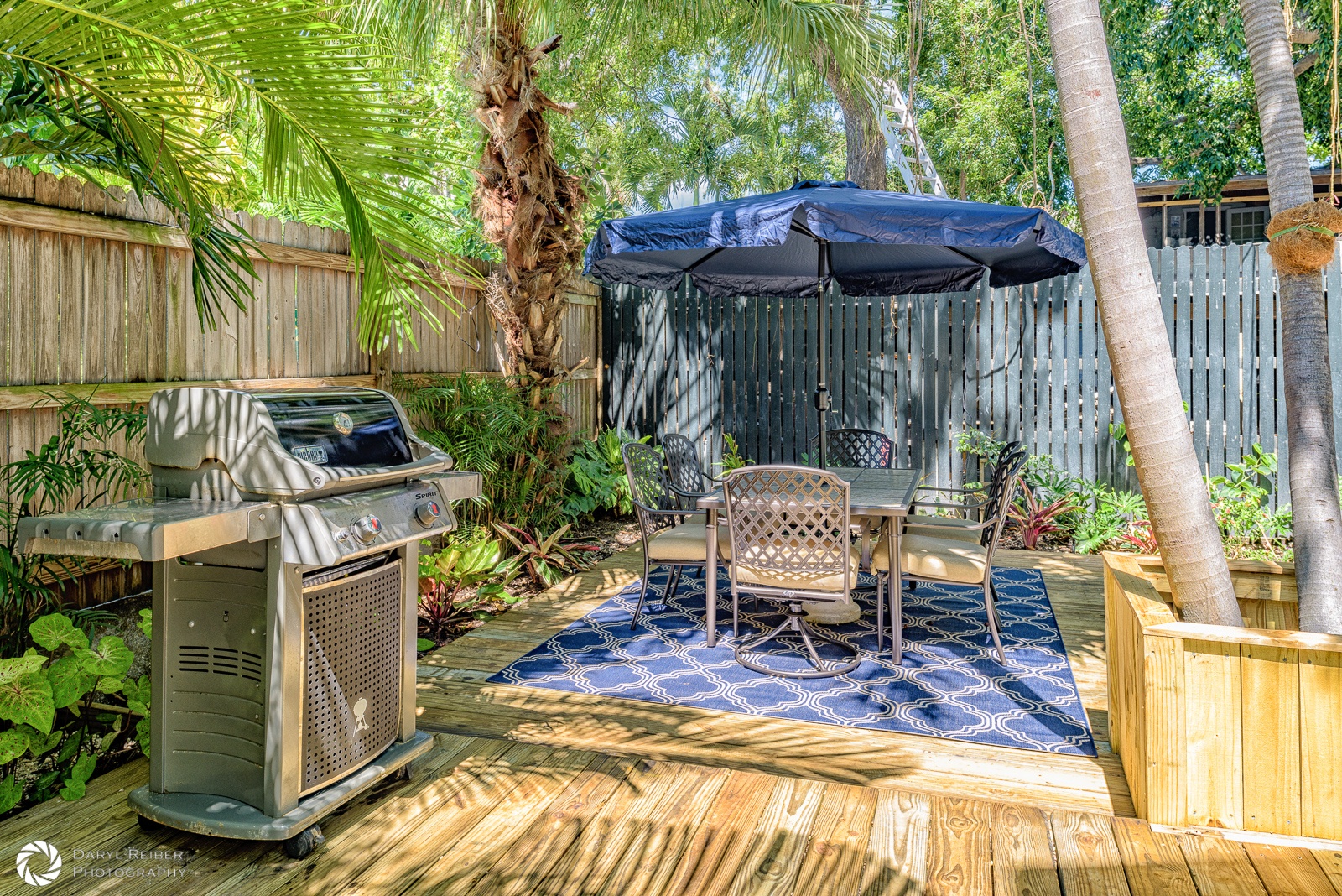 Private deck with additional seating area and grill