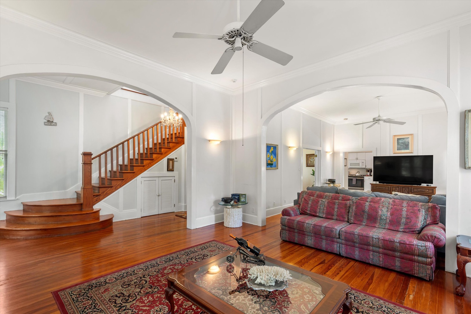 Rich timber floors and elegant archways create your welcoming retreat. Relax in the open living space where classic comfort meets timeless charm.