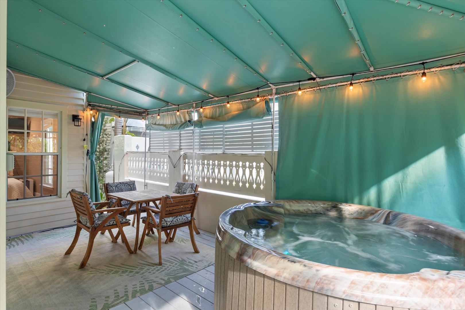 Private hot tub on wrap around porch and outdoor seating