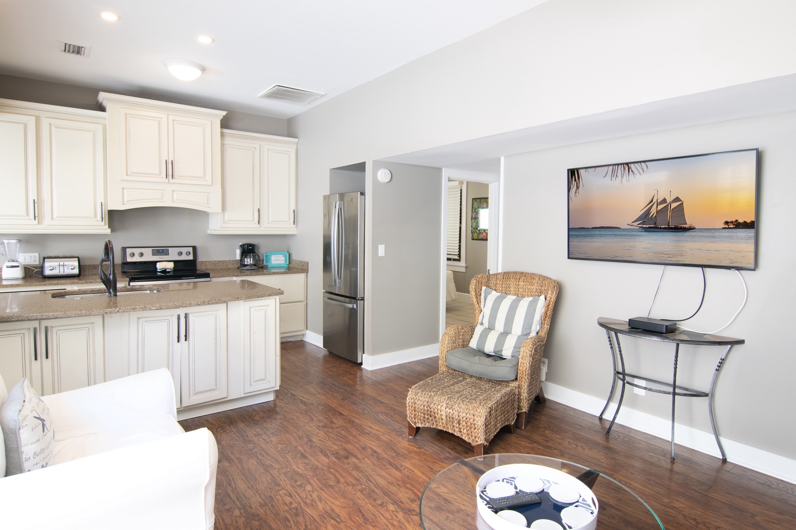 Living room with view into kitchen