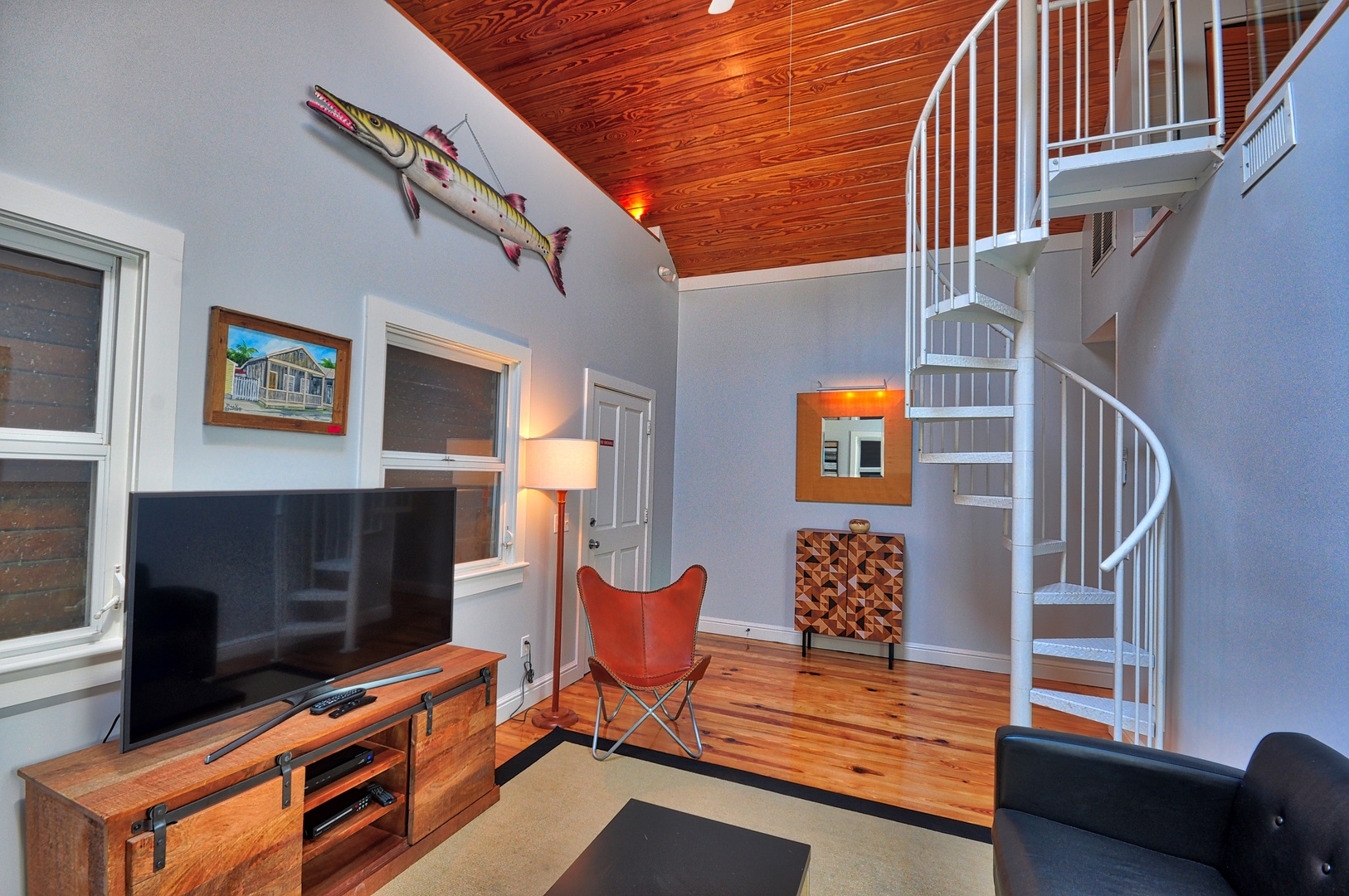 Living Room with Spiral Staircase to Loft