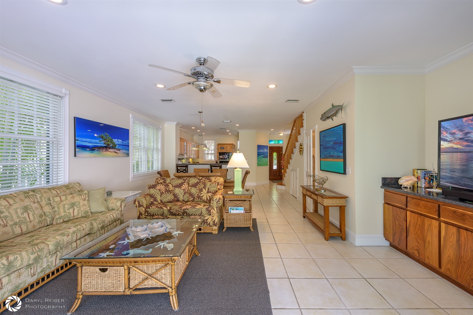 Full view of living room, dining area, kitchen and front entry