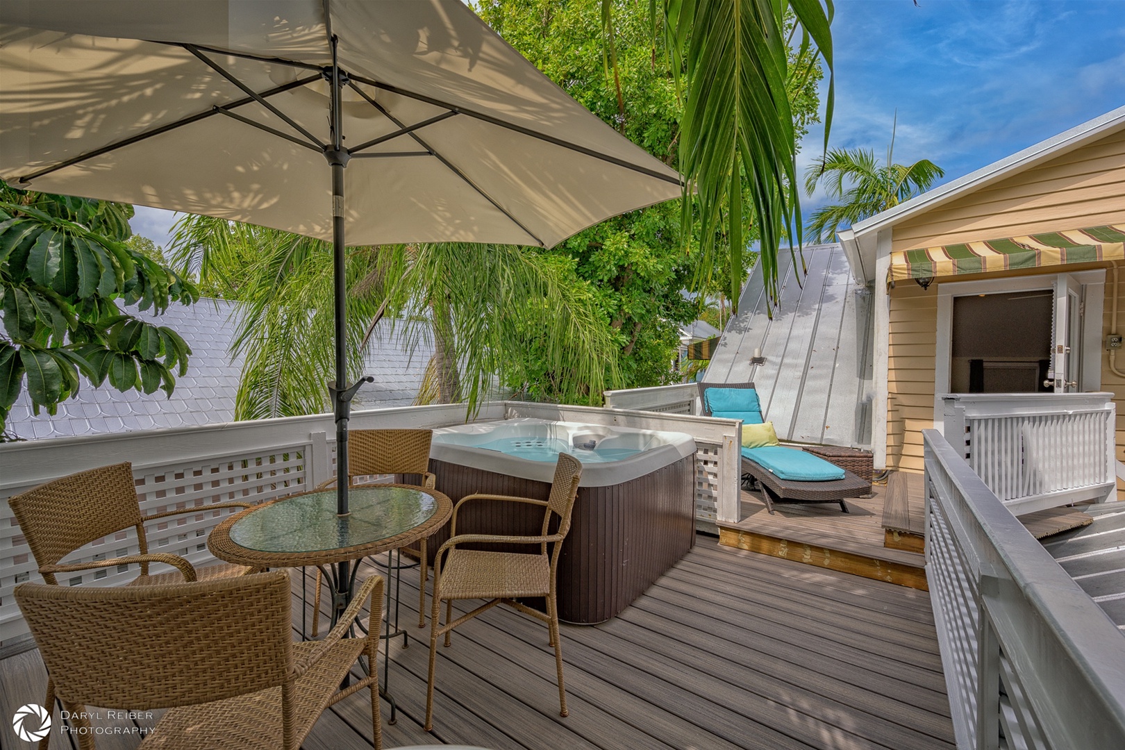 Private rooftop deck with hot tub, seating area and grill