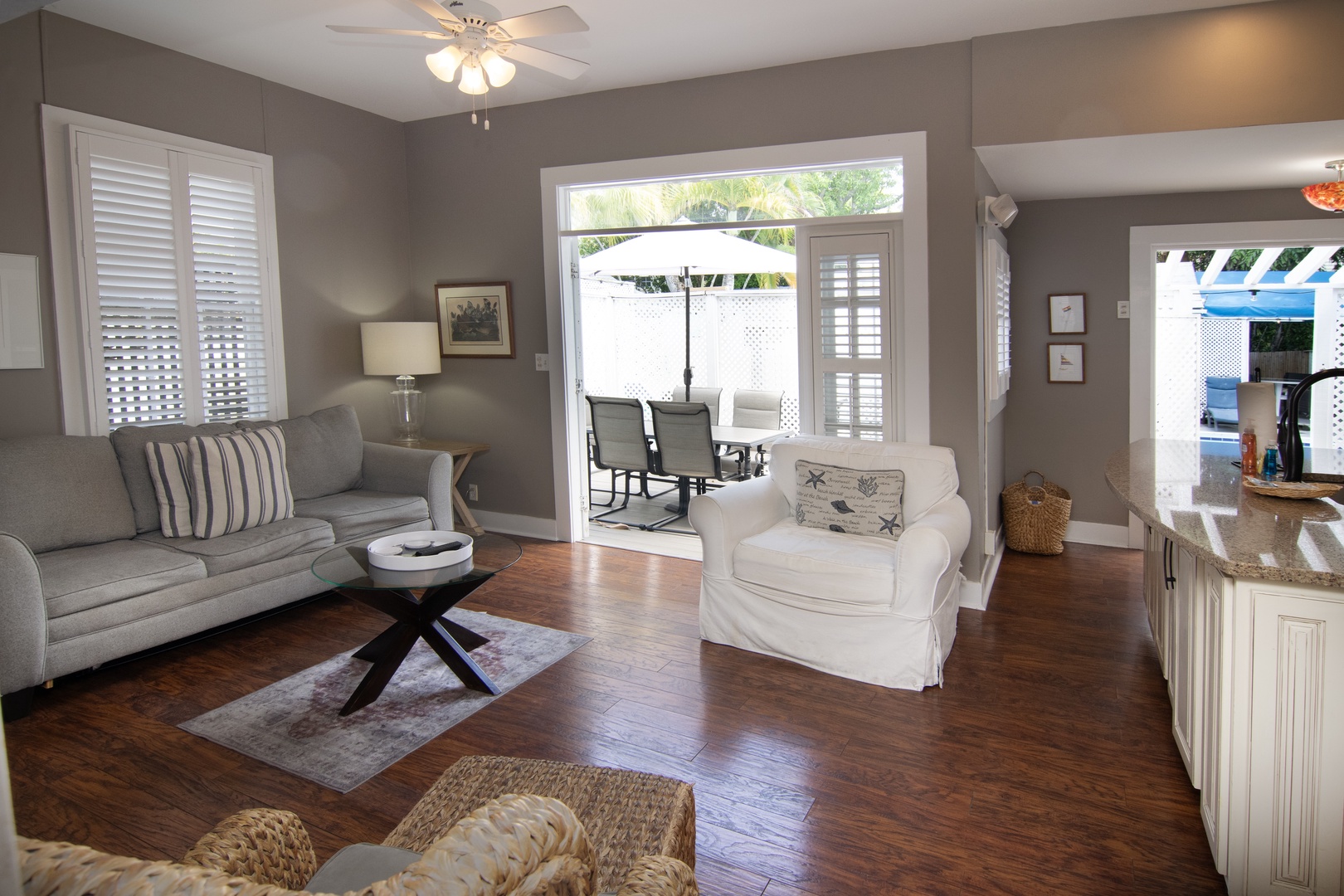 Living Room with french doors that open up to private deck with seating