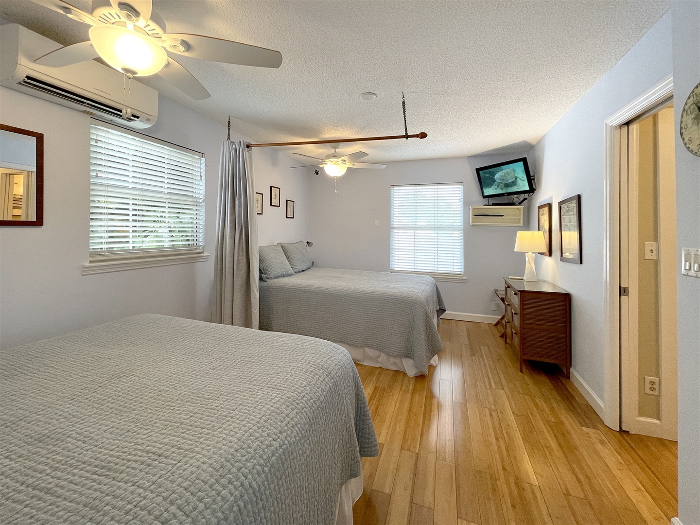 Bedroom upstairs with 2 Queen beds separated by curtain