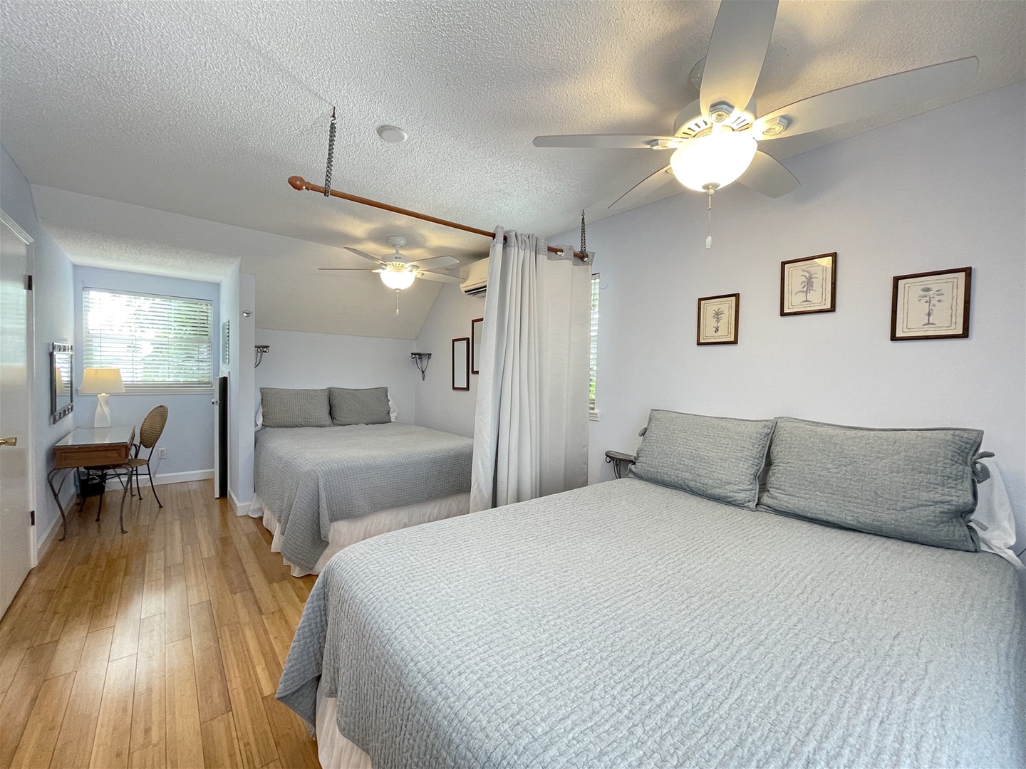 Bedroom upstairs with 2 Queen beds separated by curtain