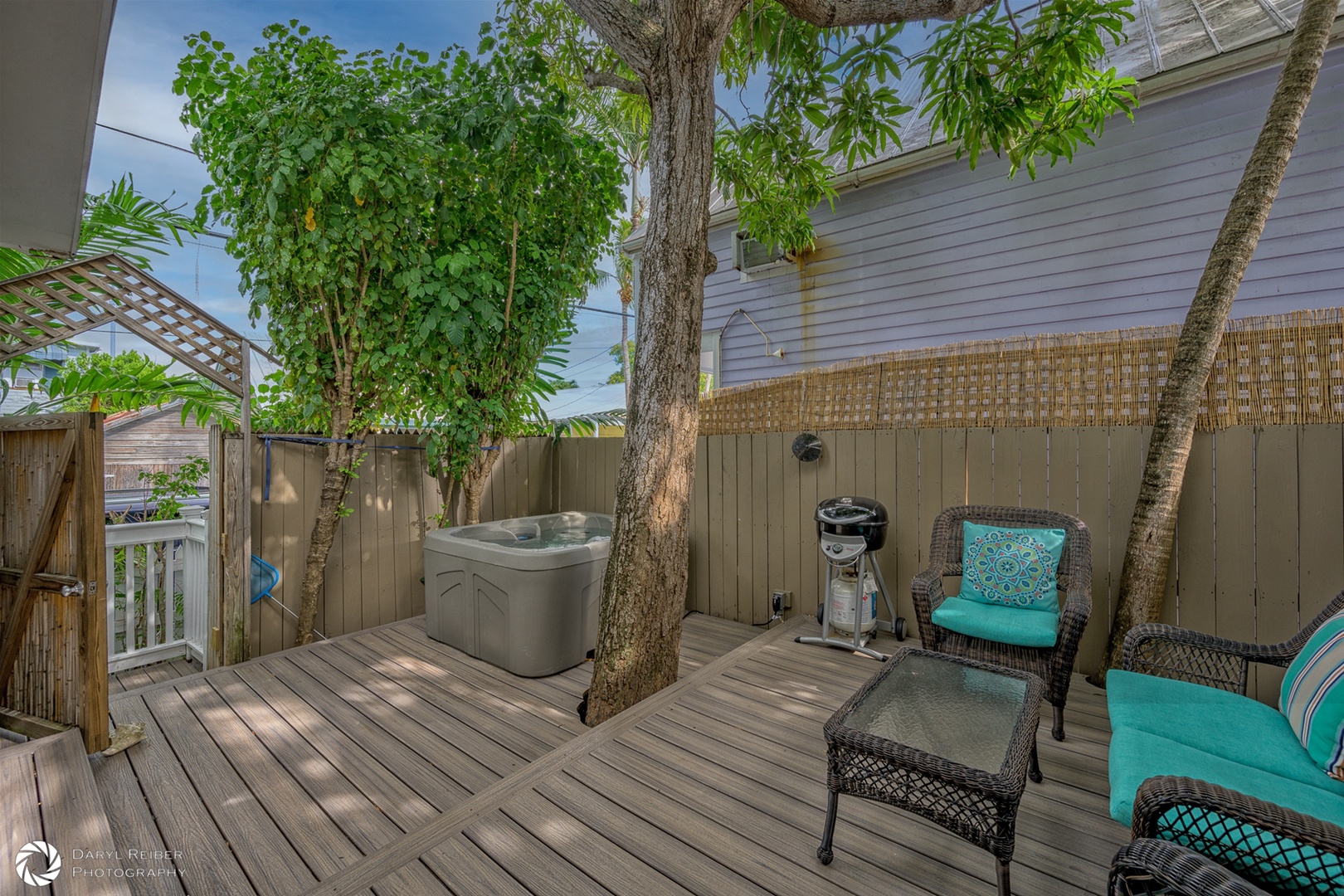 Private deck with hot tub and sitting area and grill