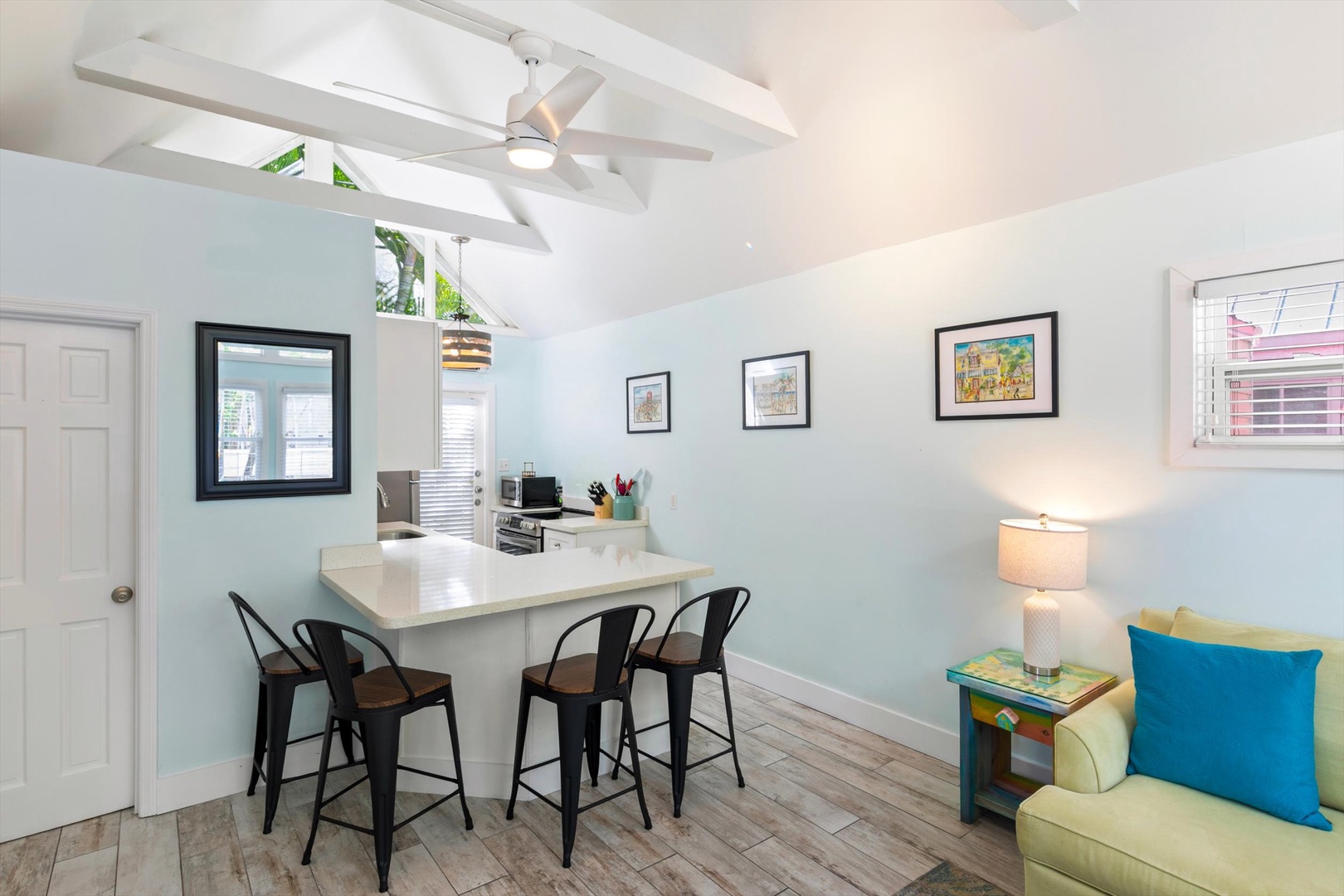 Your bright, breezy retreat features vaulted ceilings and a cheerful open layout where kitchen and living areas flow together—perfect for morning coffee or casual meals with loved ones.