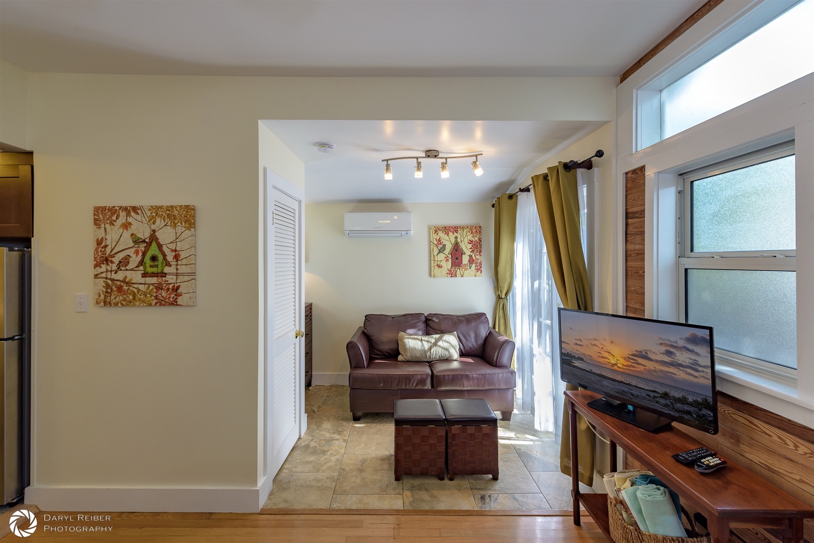 Sofa sitting area with french doors that open onto private deck