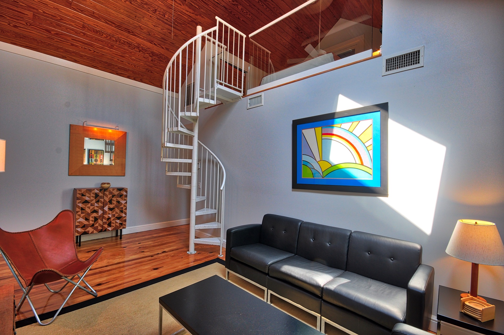 Living Room with Spiral Staircase to Loft