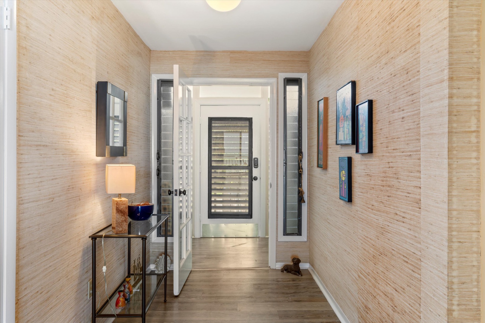 Entry hallway into front entry seating area
