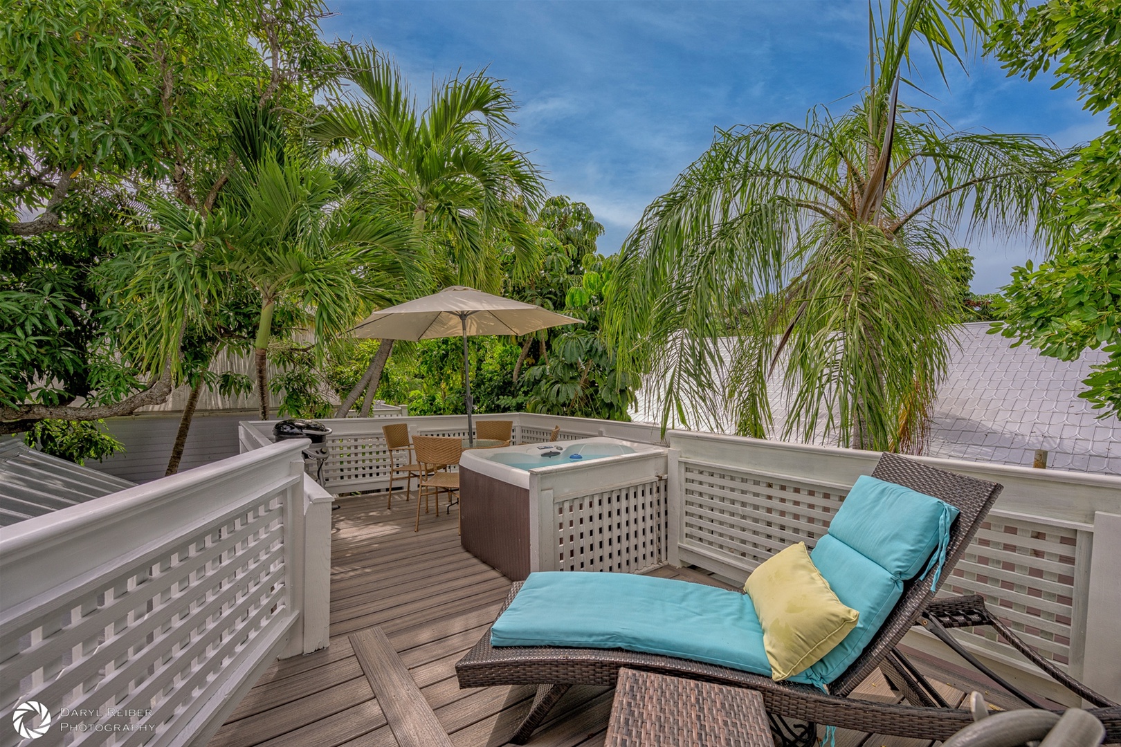 Private rooftop deck with hot tub, seating area and grill