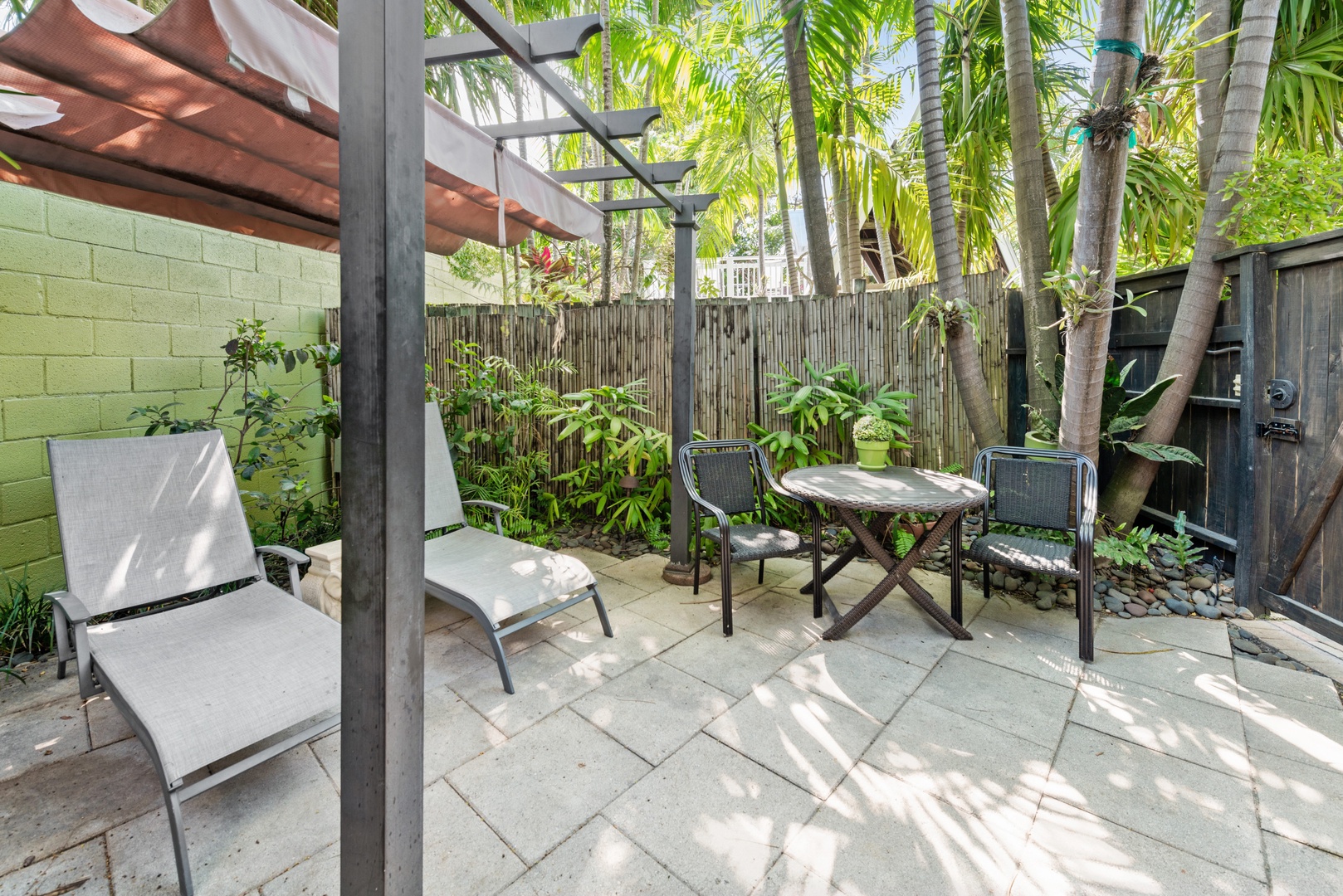 Private fenced in patio with seating