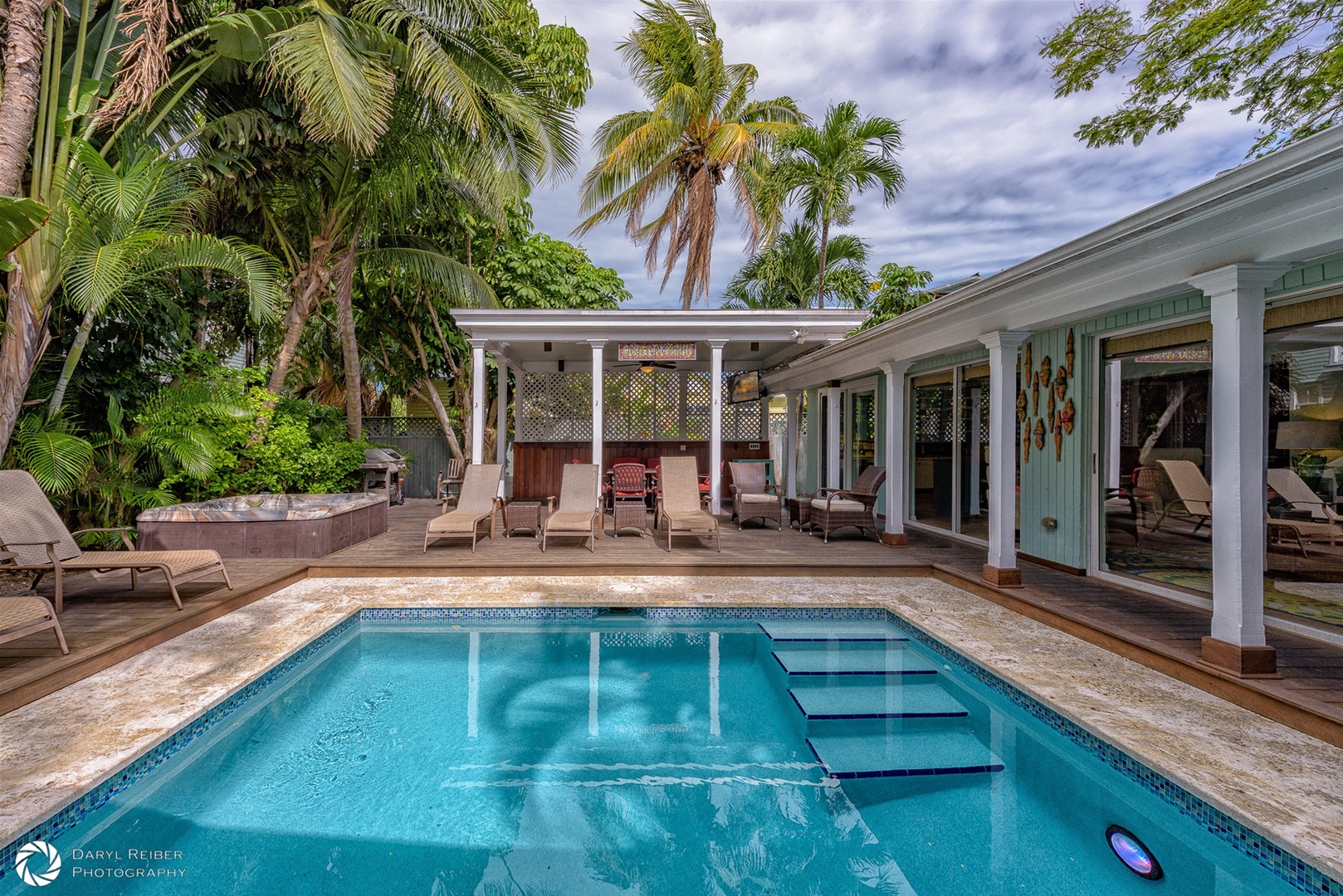 Private Pool and Hot tub with lounge chairs and covered seating area