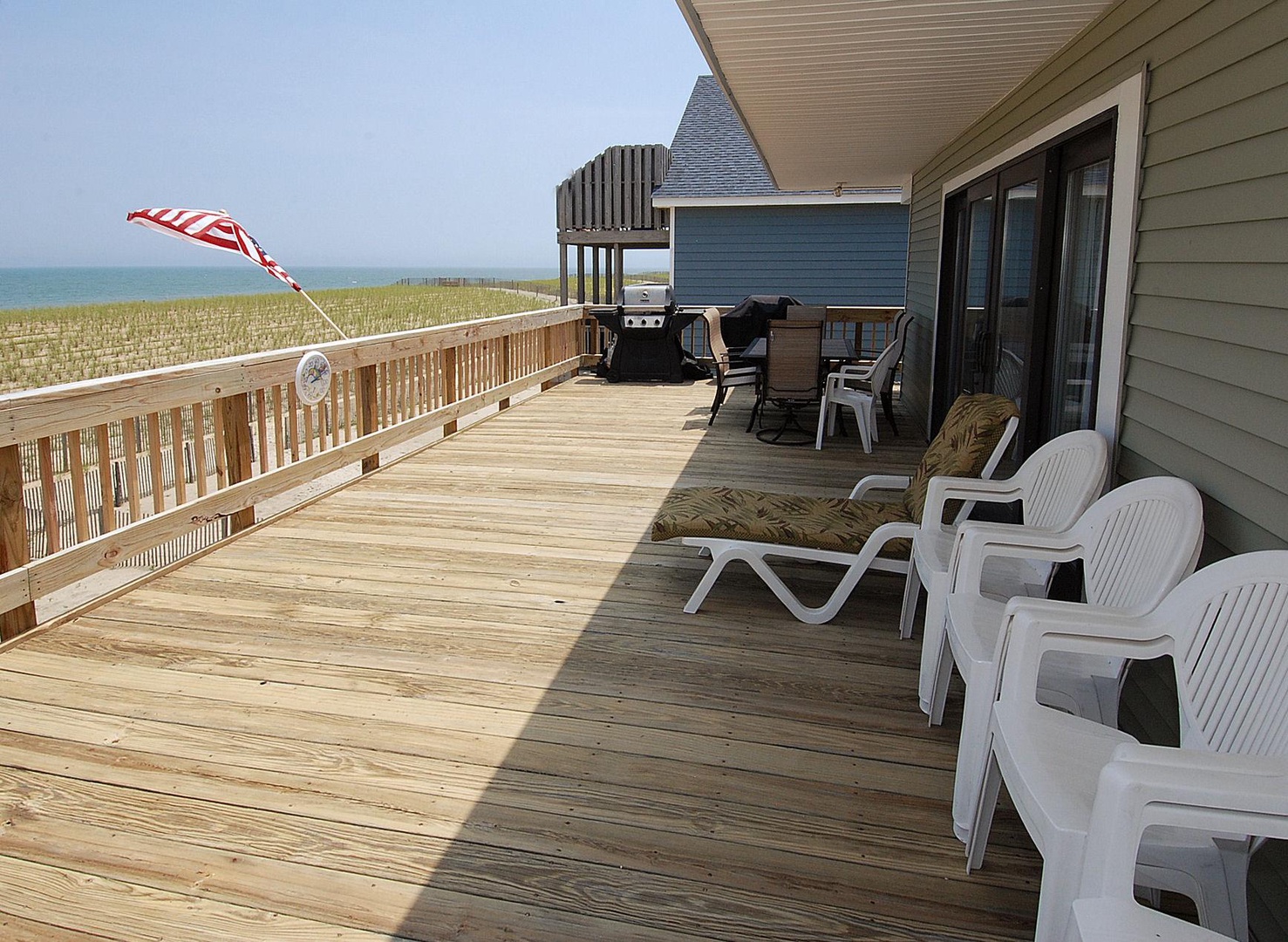 Step onto your private deck where ocean breezes and coastal views await. Lounge on plush chairs, fire up the grill, and dine outdoors with the beach just steps away from your retreat.
