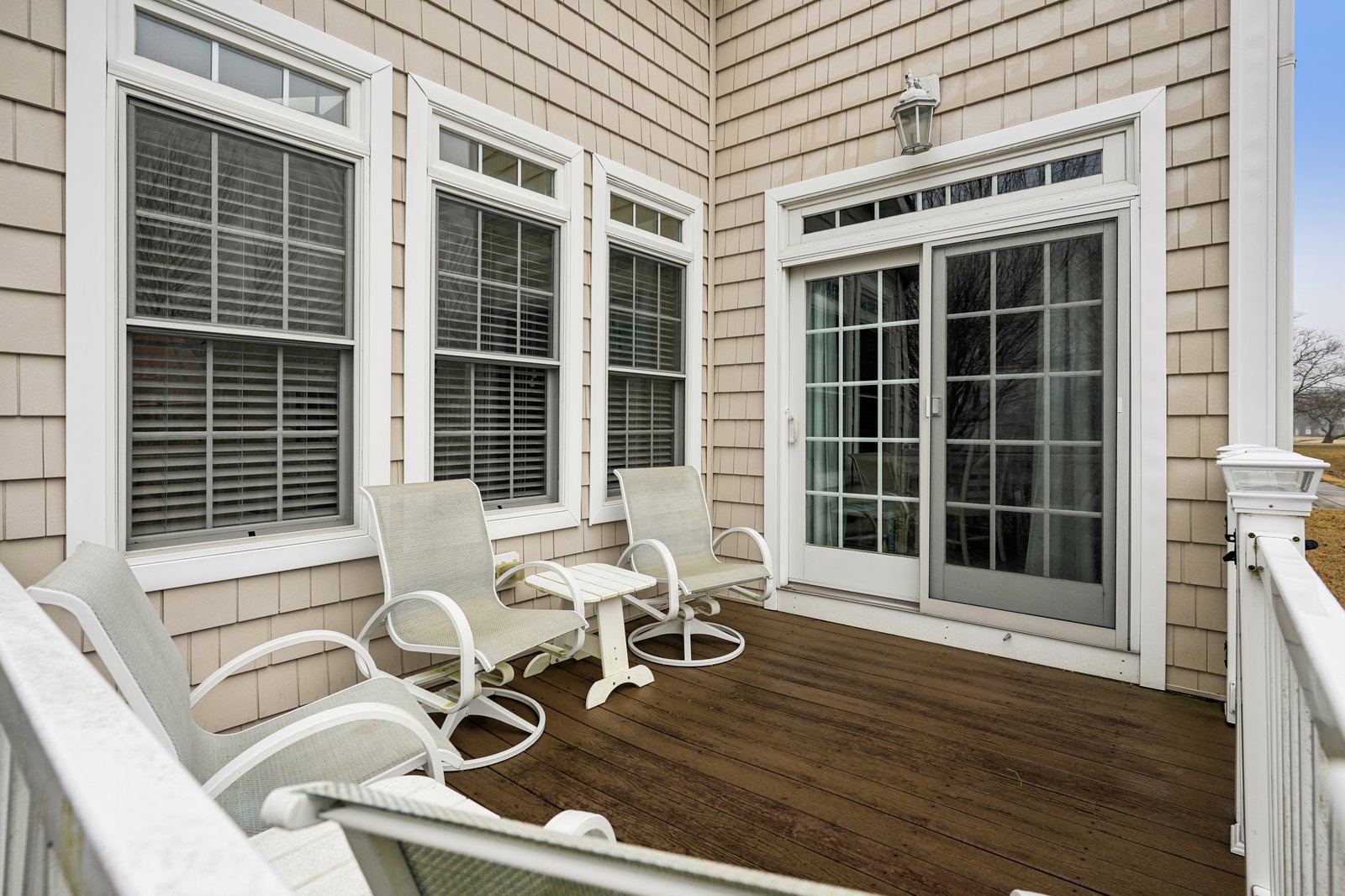 Relax on your private deck with comfortable seating and French doors opening to bright indoor spaces.