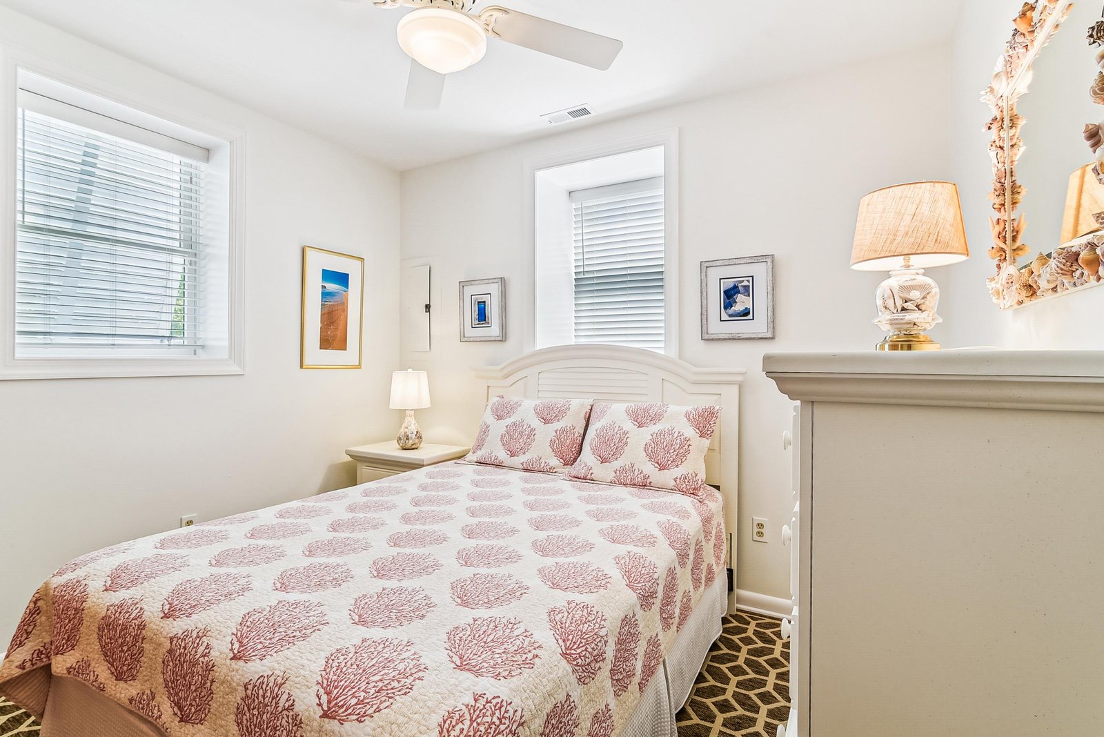 Slip into this cozy coastal bedroom with soft lighting and gentle ocean-inspired accents. The comfortable queen bed and calming decor invite your most restful night's sleep.