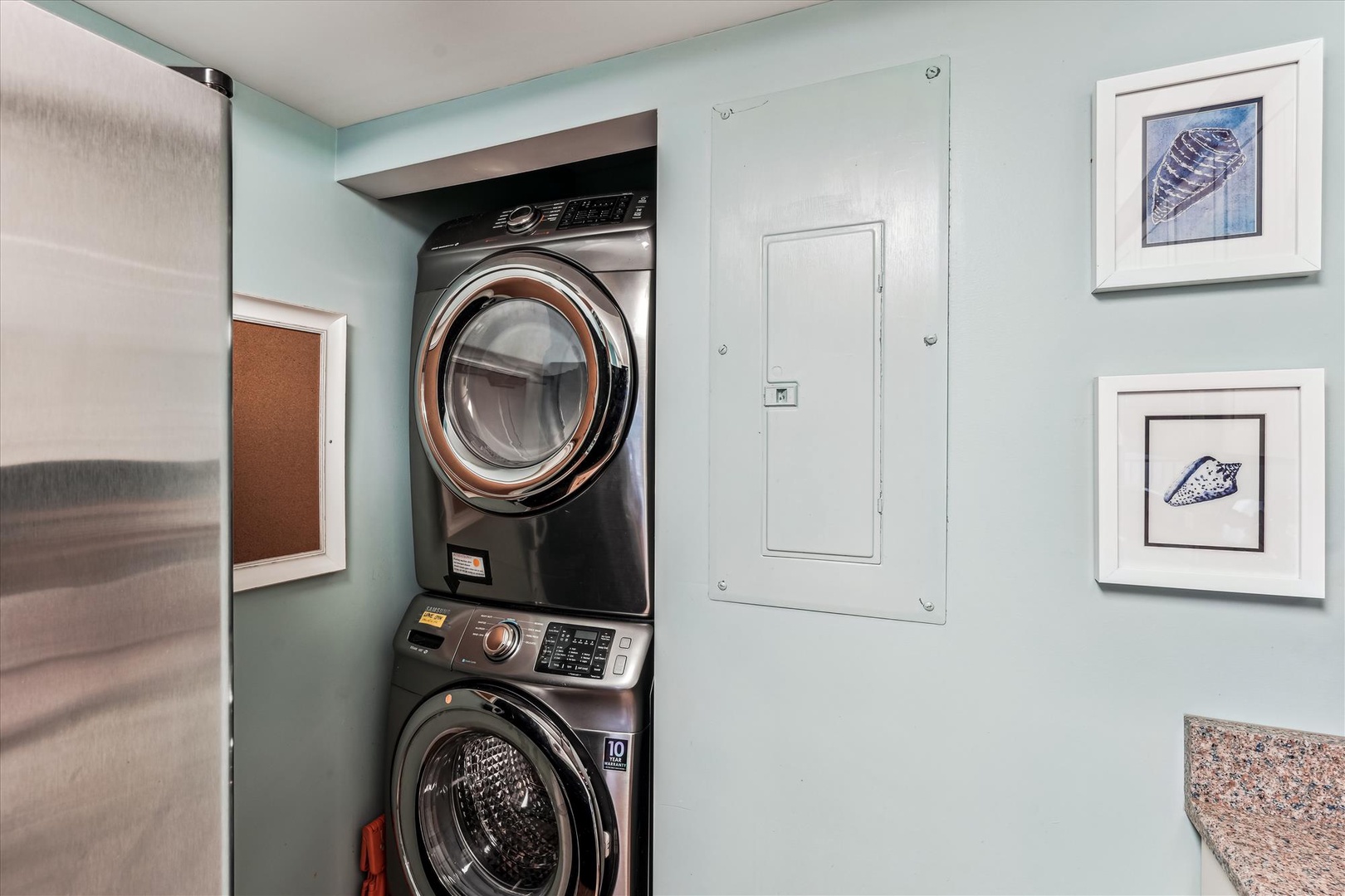 Your private laundry nook keeps travel light with sleek stacked washer and dryer, perfectly tucked away yet easily accessible.