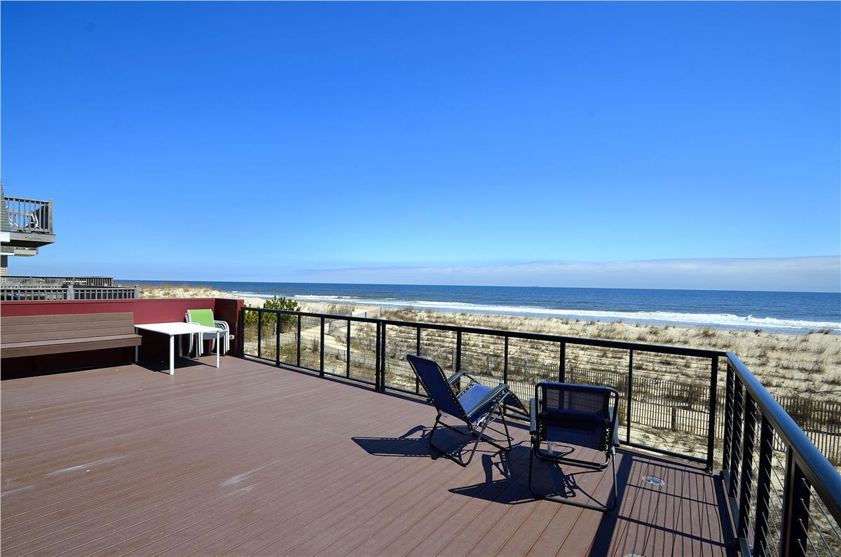 Step out onto your private oceanfront deck where the sound of waves and endless blue horizon await. Perfect for morning coffee or sunset cocktails, this is coastal living at its finest.