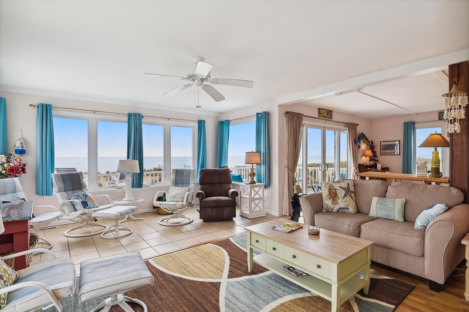 Relax in your spacious living room with breathtaking sea views. Plush seating, coastal décor, and abundant natural light create a tranquil retreat where you can unwind after a day of exploring.