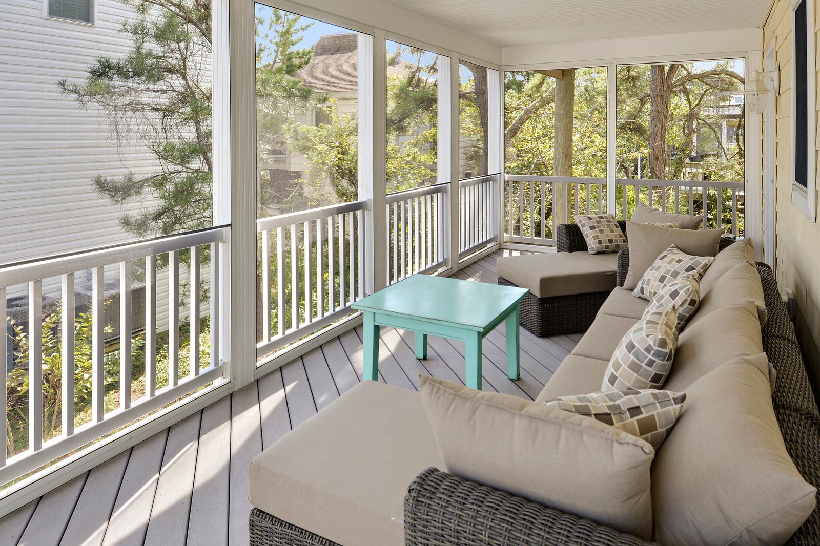 Step onto your private screened porch and sink into cushioned seating overlooking a leafy, peaceful neighborhood—your perfect spot to unwind with morning coffee or an evening breeze.
