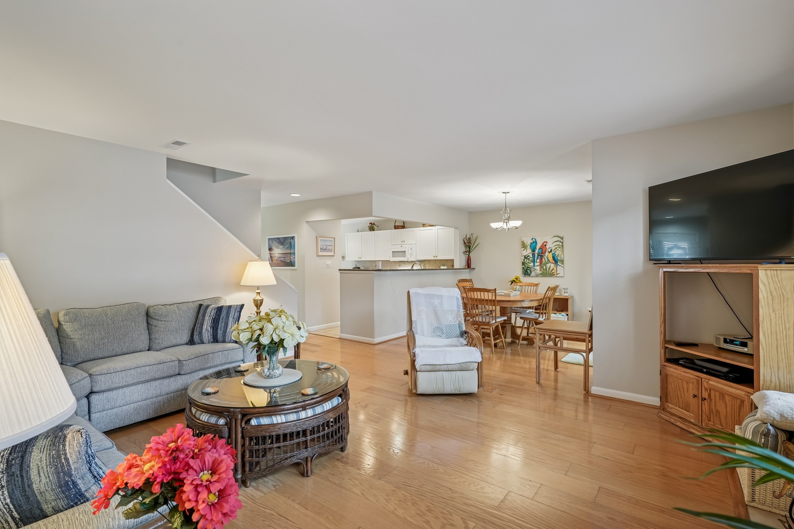 Unwind in your open-concept living space where coastal comfort meets modern convenience, perfect for gathering with loved ones.