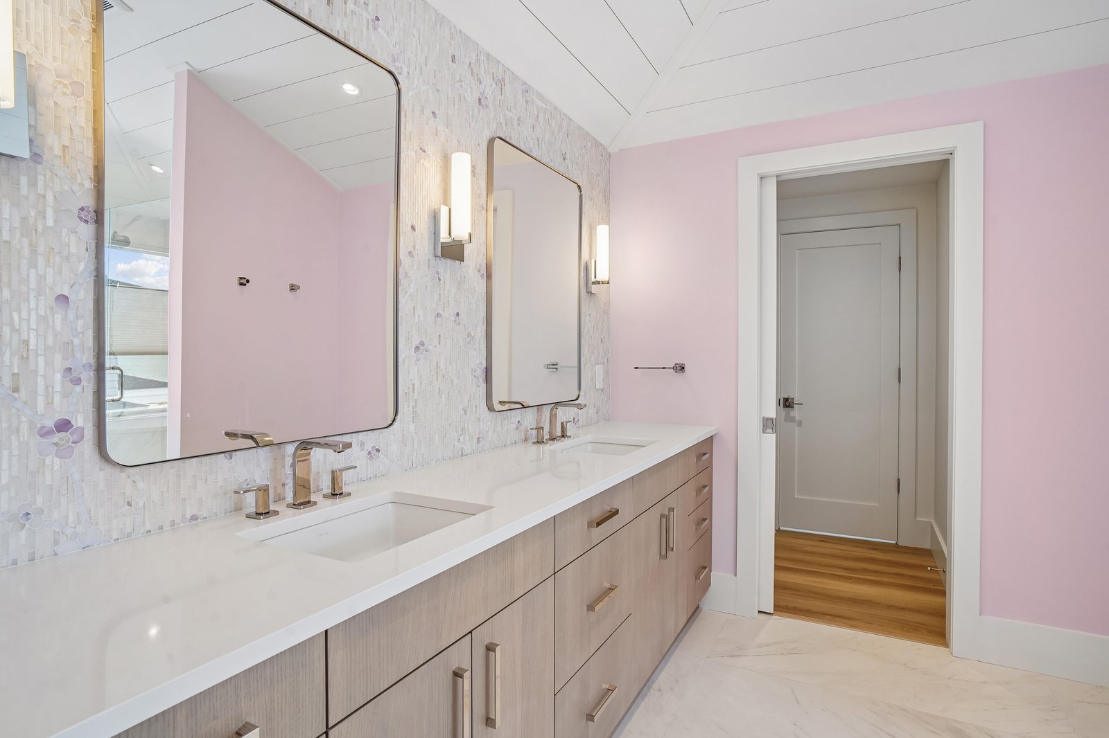 Refresh and recharge in your serene bathroom with dual vanities, modern fixtures, and soft lighting that sets a calming tone for your morning routine.