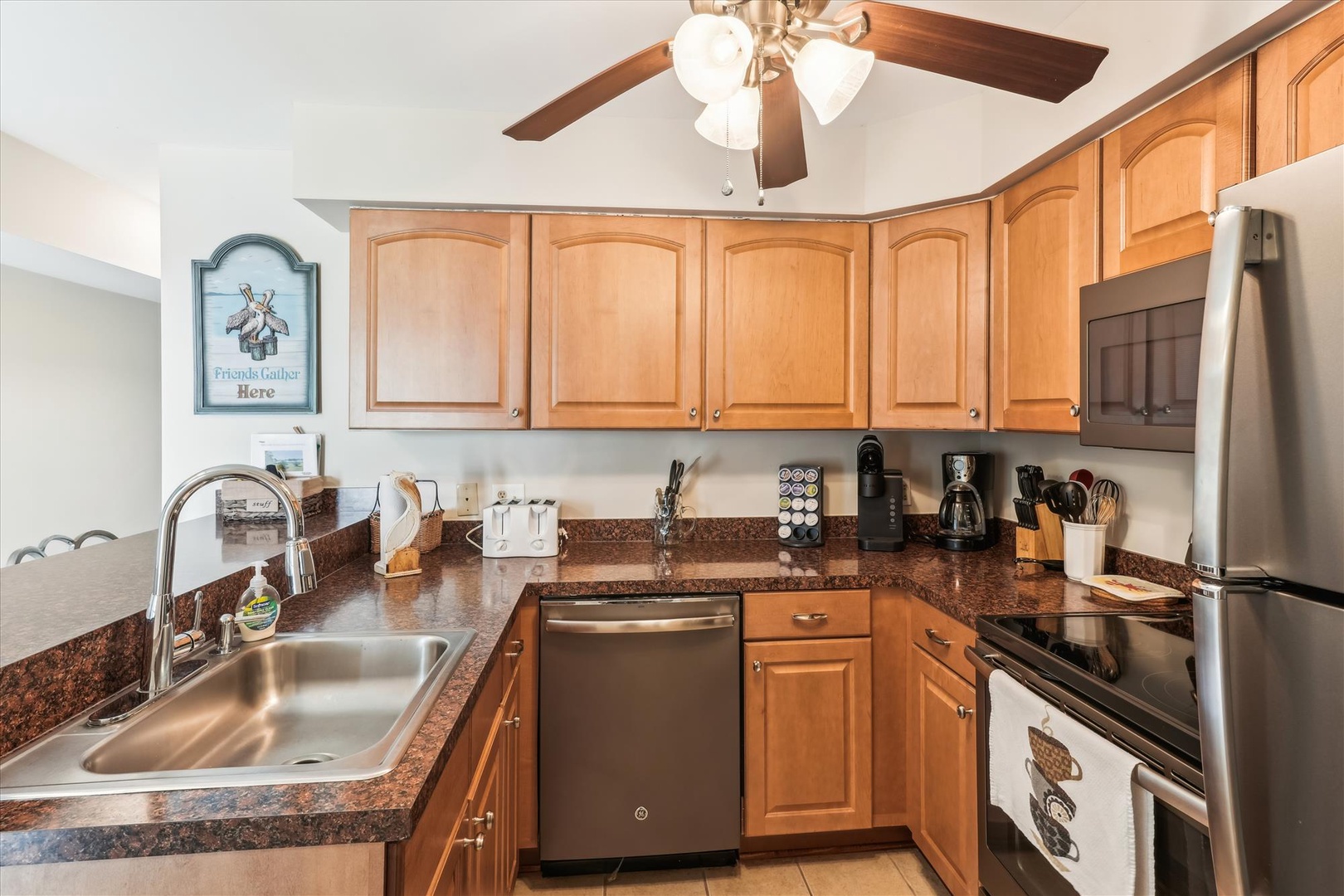 Your fully equipped kitchen features warm wood cabinets, granite counters, and stainless appliances—everything you need to create memorable meals during your stay.