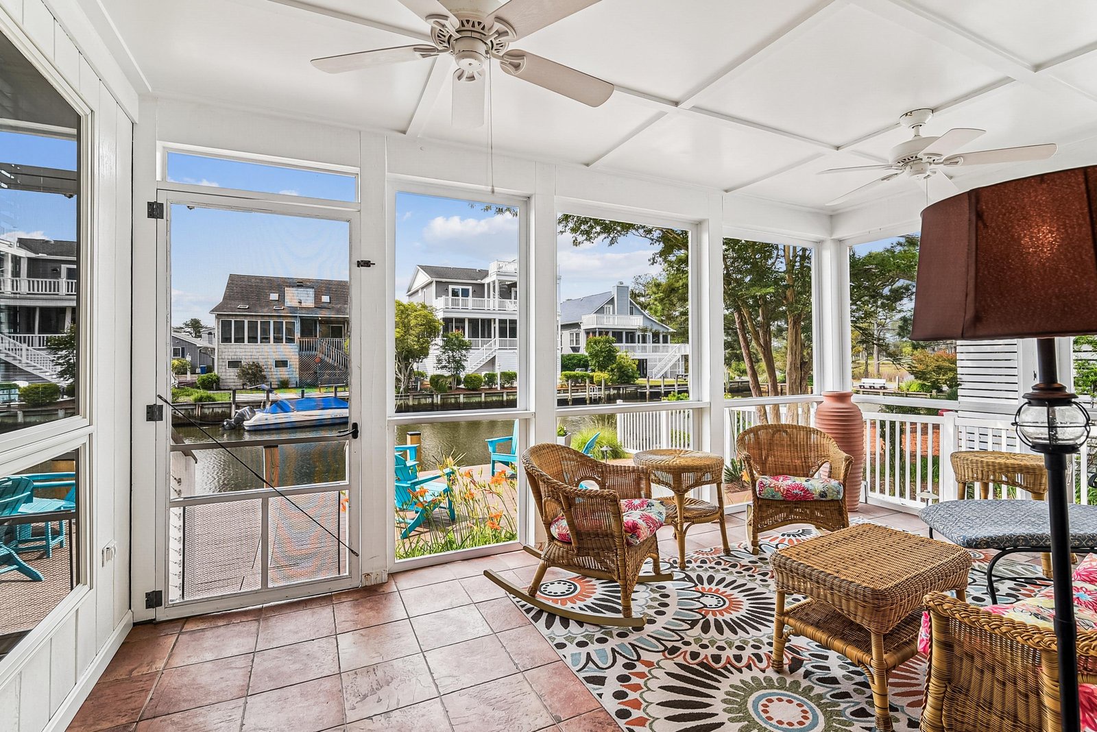 Settle into your own private screened-in porch with comfortable wicker seating, soft breezes, and peaceful views of the canal and charming waterfront neighborhood. It's the perfect spot to unwind with your morning coffee or an evening glass of wine.