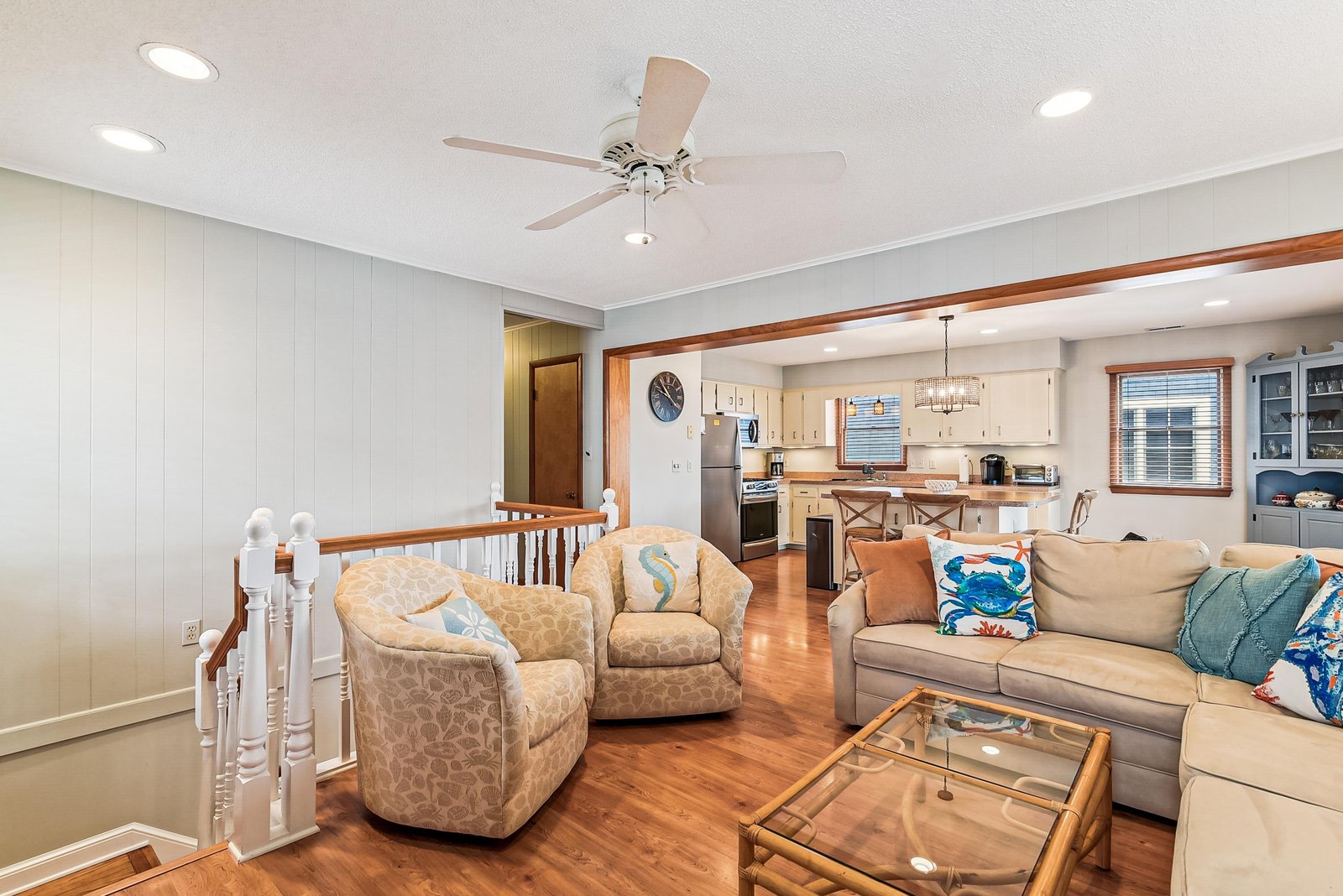Settle into your coastal-inspired living space, where beach-themed accents and an open layout invite you to unwind. The airy flow into the kitchen makes this home perfect for gathering and relaxing.